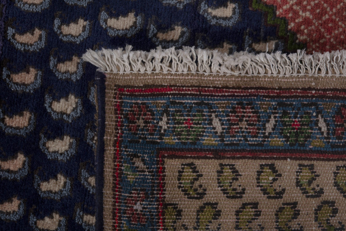 Persian Songhor accent rug in navy and dusty rose, view 9 of 9
