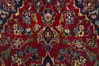 Persian Kashan accent rug in deep red and navy, view 7 of 10