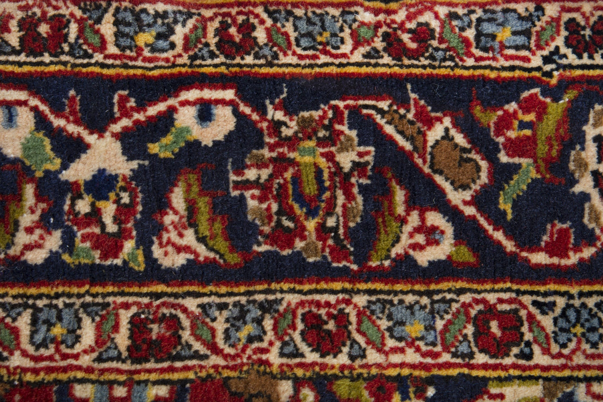 Persian Kashan accent rug in deep red and navy, view 9 of 10