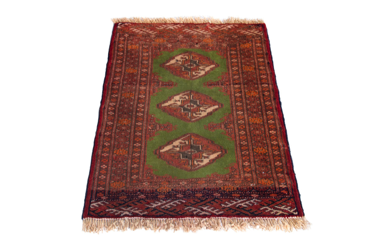 Persian Torkaman accent rug in deep red and olive, view 3 of 9