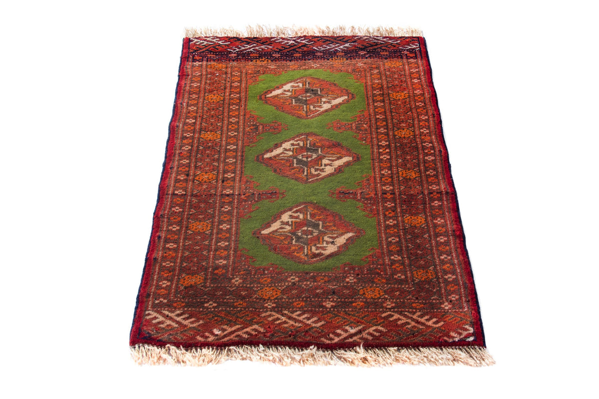 Persian Torkaman accent rug in deep red and olive, view 4 of 9