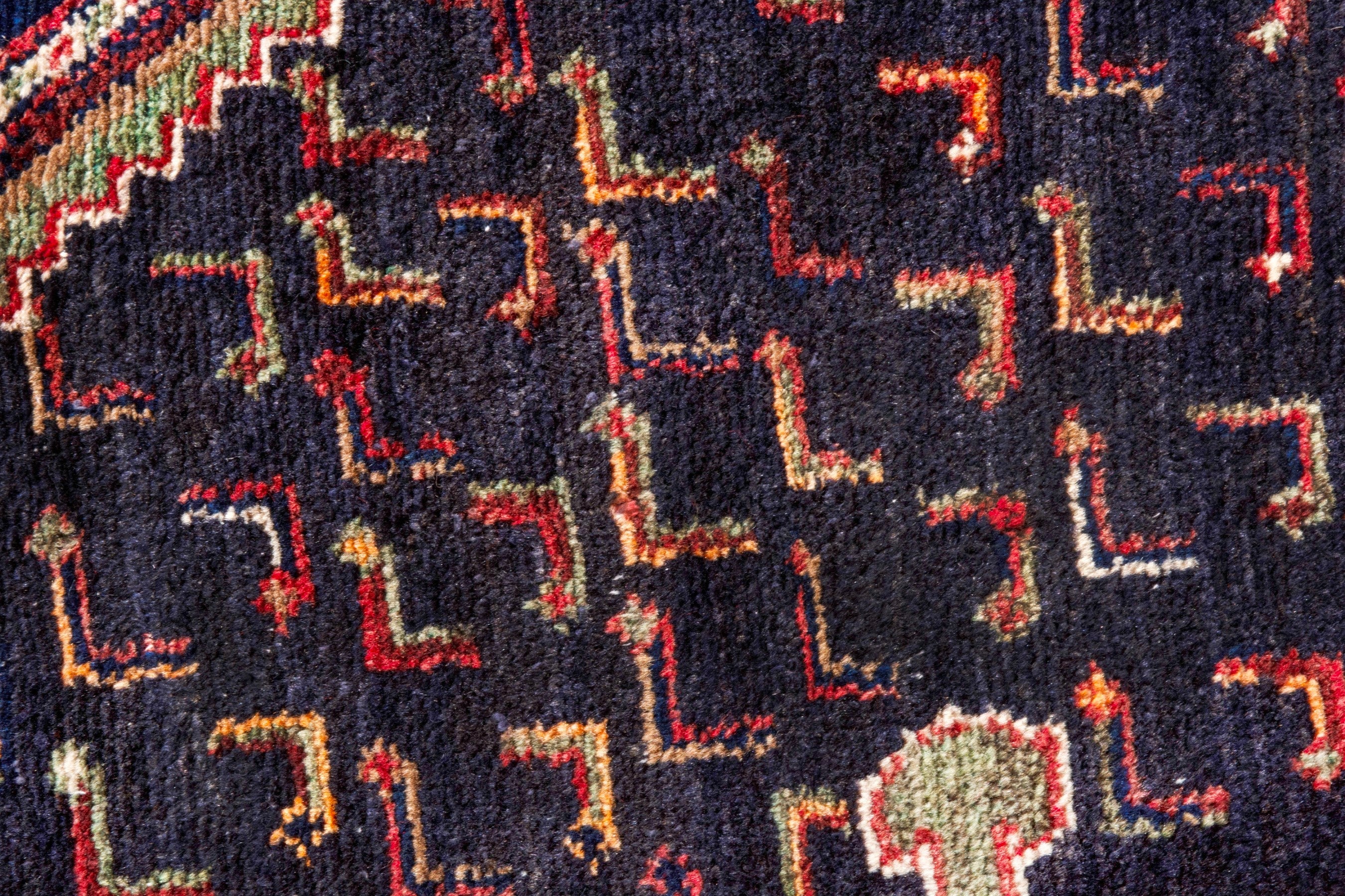 Persian Songhor area rug in navy and rust, view 14 of 20