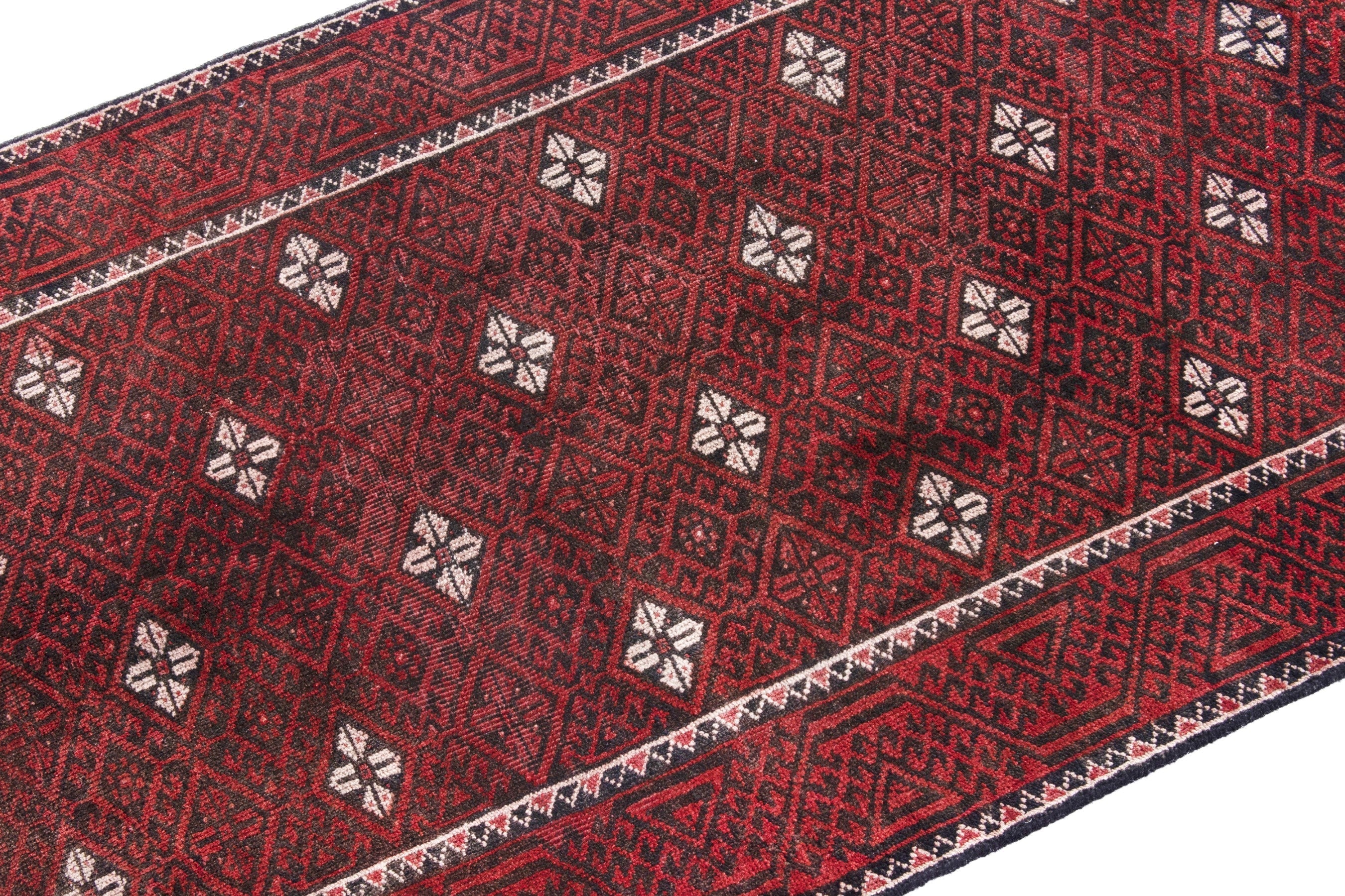 Persian Baluch accent rug in deep red and cream, view 6 of 18