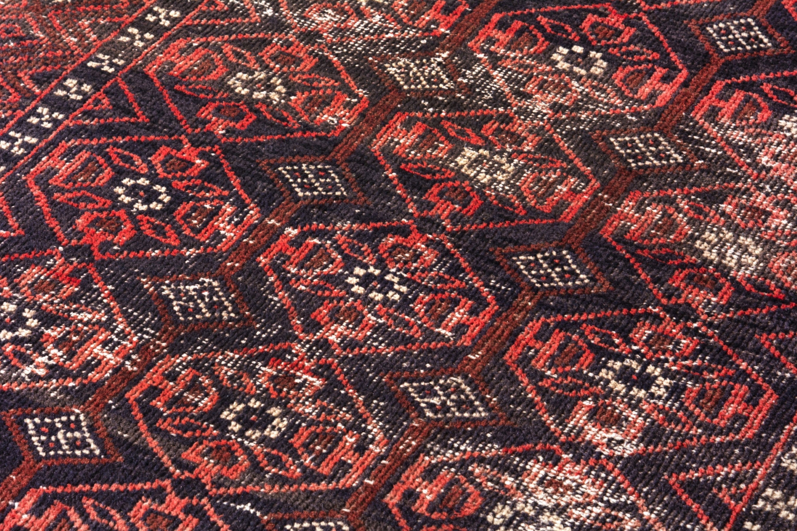 Persian Baluch area rug in deep red and burgundy, view 9 of 17