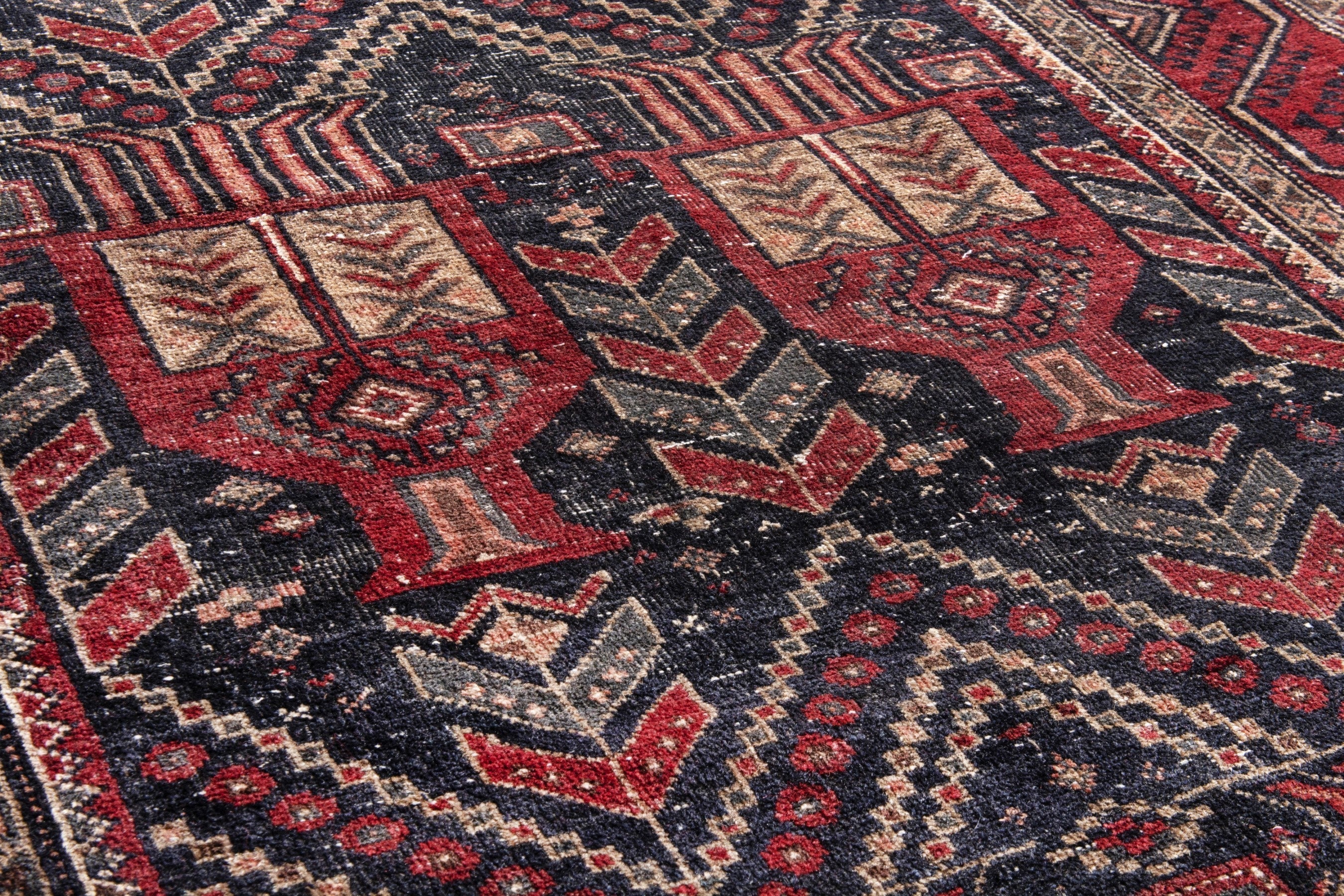 Persian Baluch area rug in deep red and burgundy, view 10 of 17