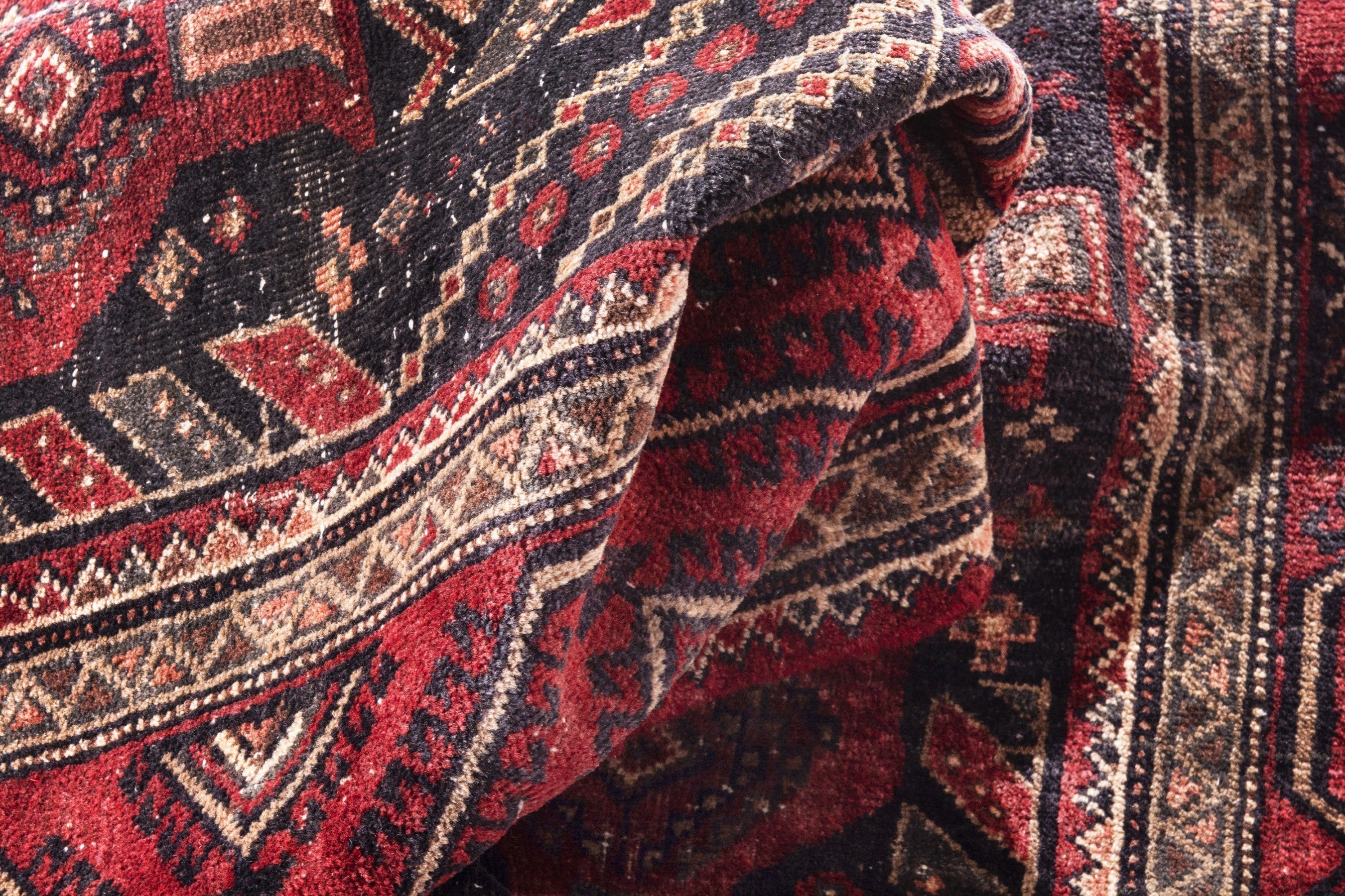 Persian Baluch area rug in deep red and burgundy, view 14 of 17