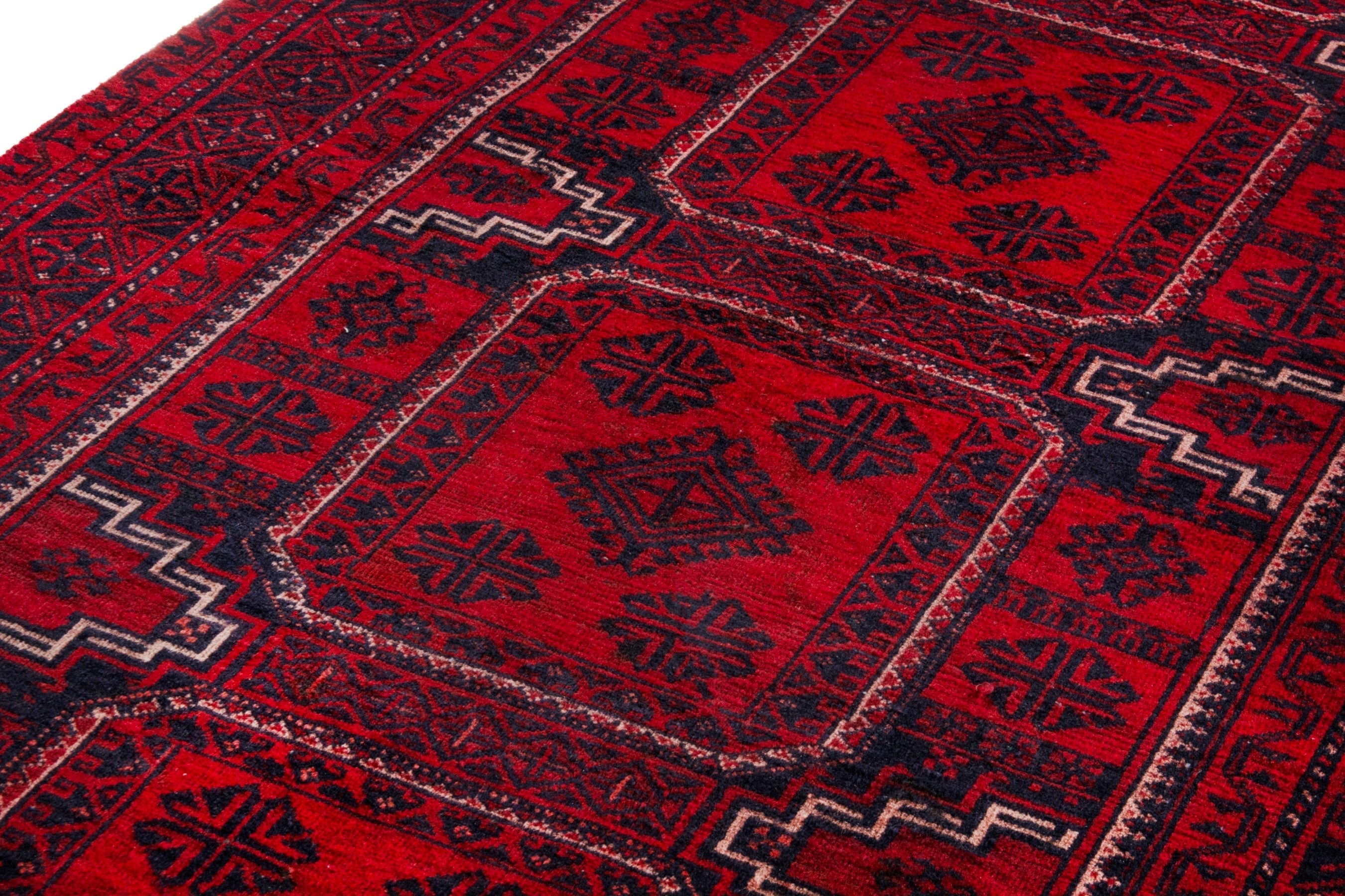 Persian Baluch runner rug in deep red and burgundy, view 9 of 20