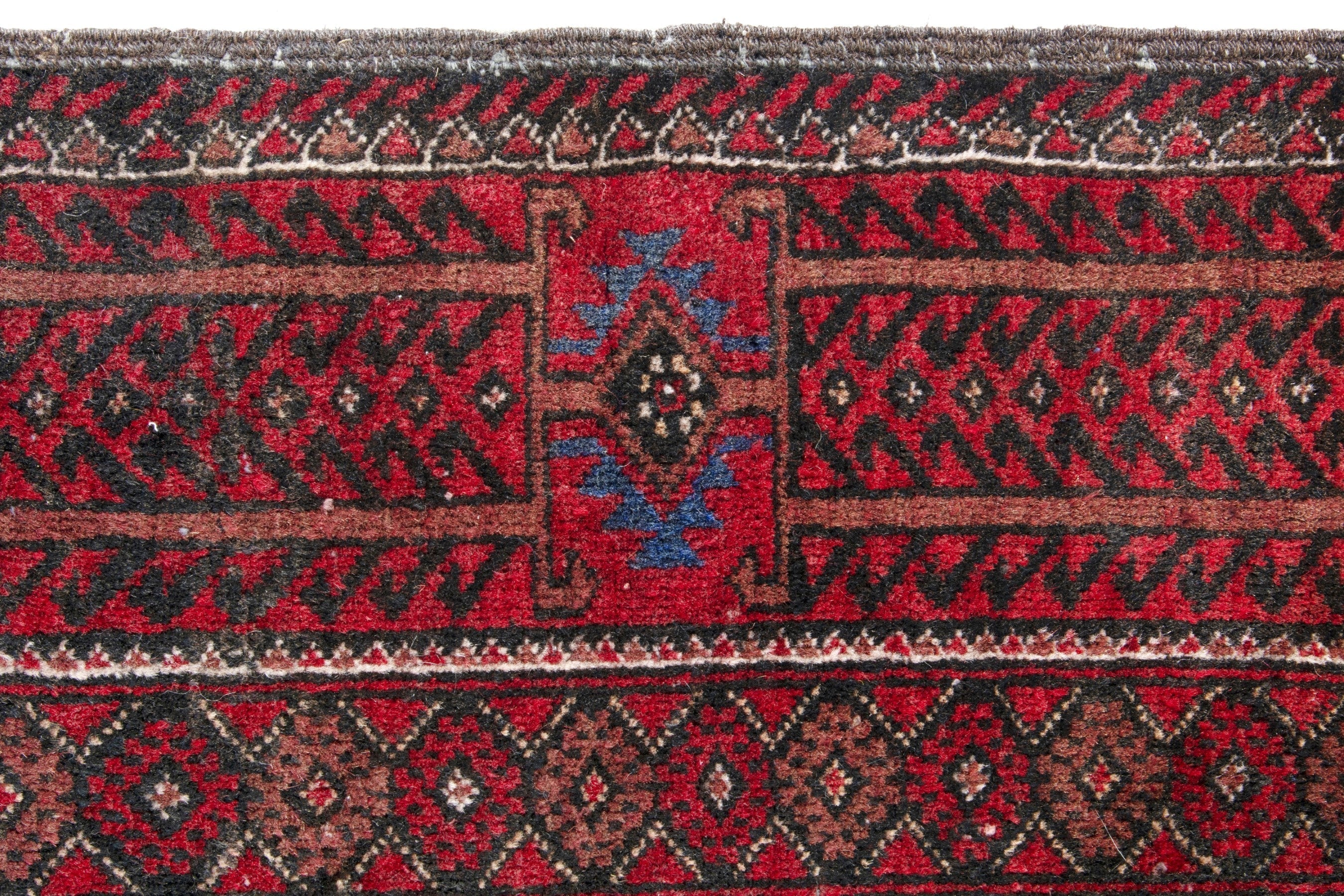 Persian Baluch runner rug in deep red and burgundy, view 12 of 17