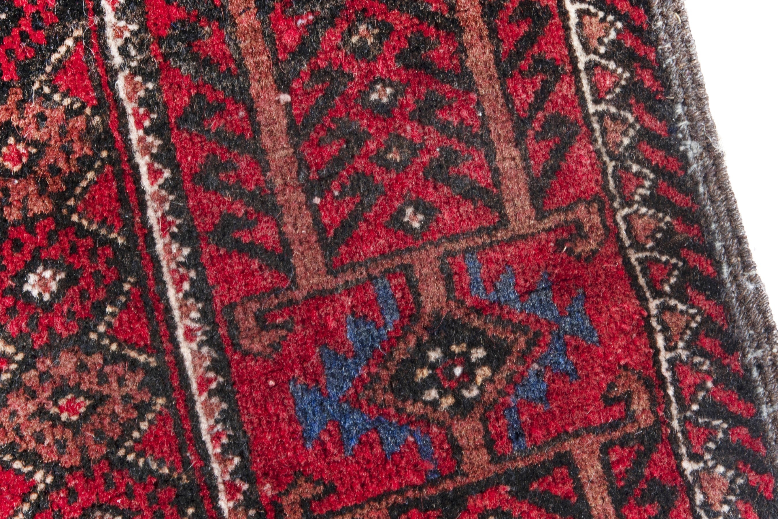 Persian Baluch runner rug in deep red and burgundy, view 7 of 17