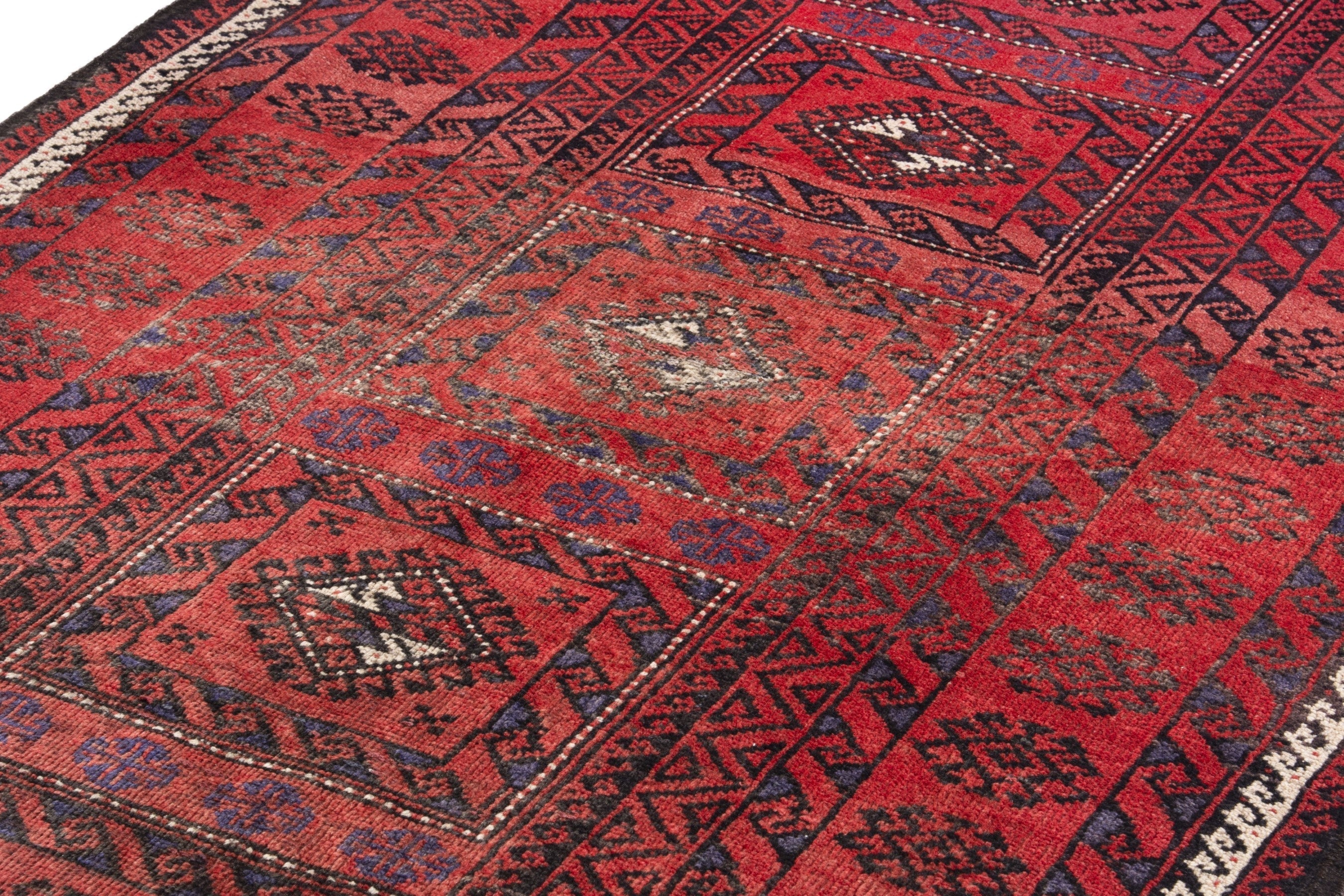 Persian Baluch runner rug in deep red and burgundy, view 9 of 18