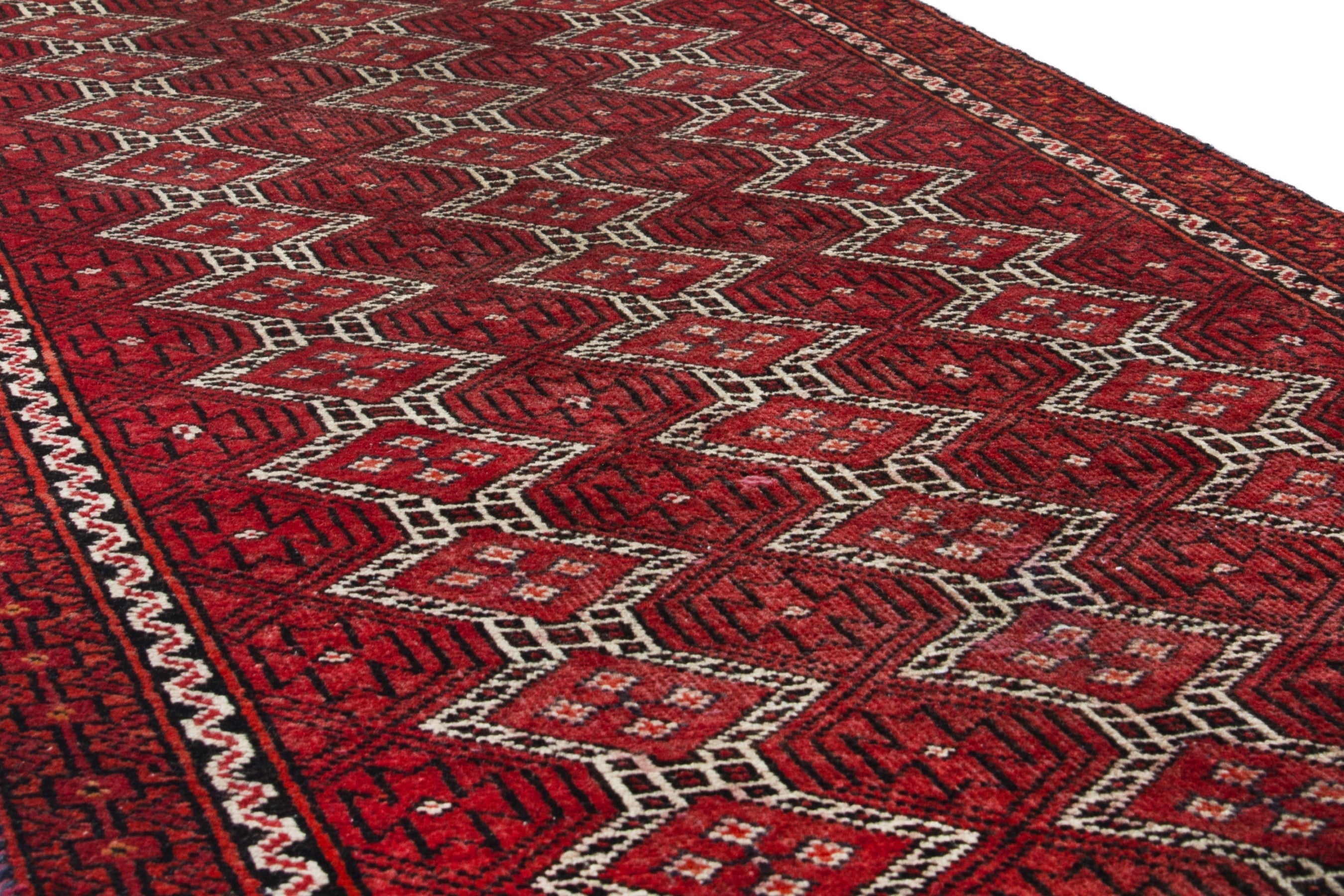 Persian Baluch runner rug in deep red and cream, view 10 of 17
