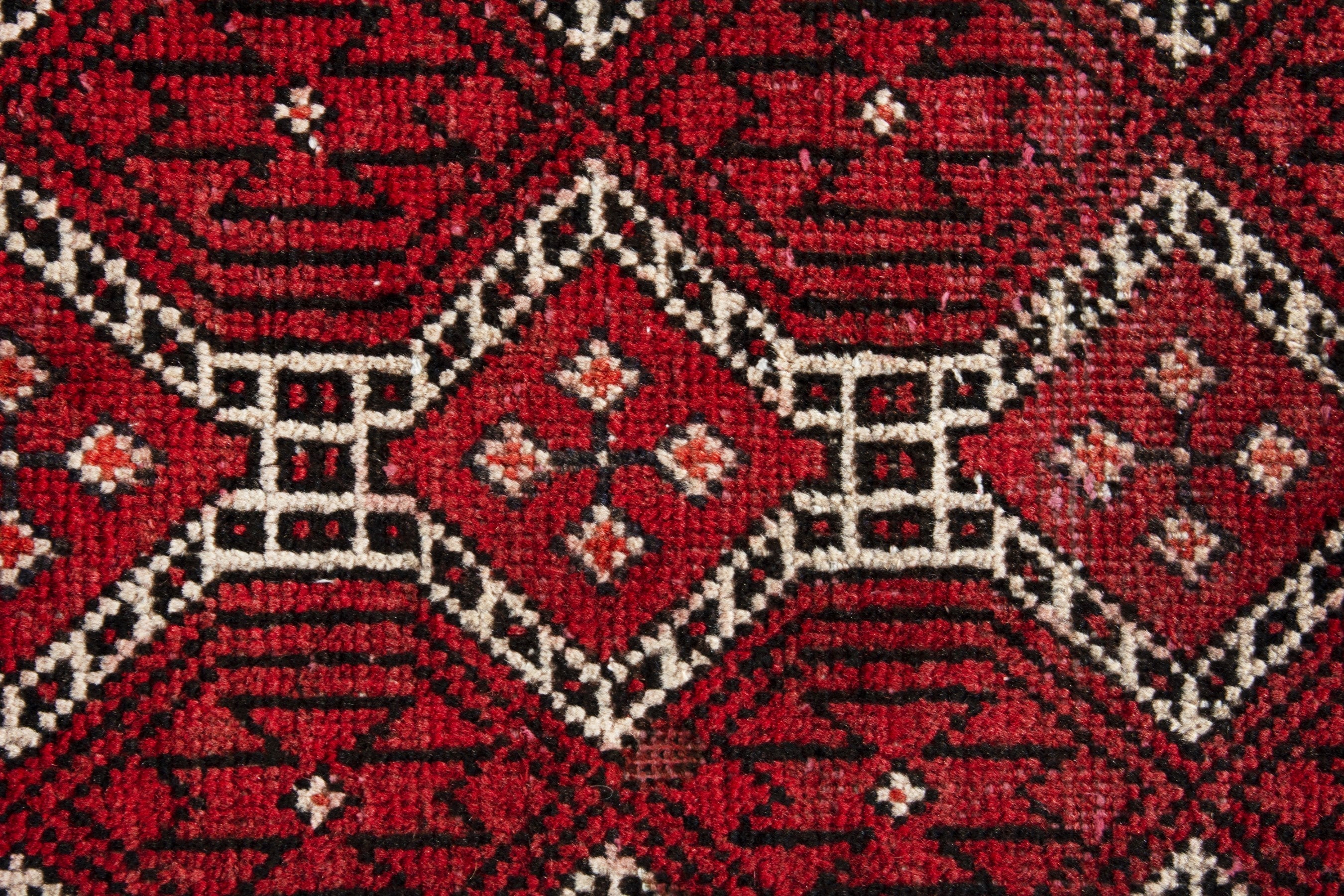 Persian Baluch runner rug in deep red and cream, view 11 of 17