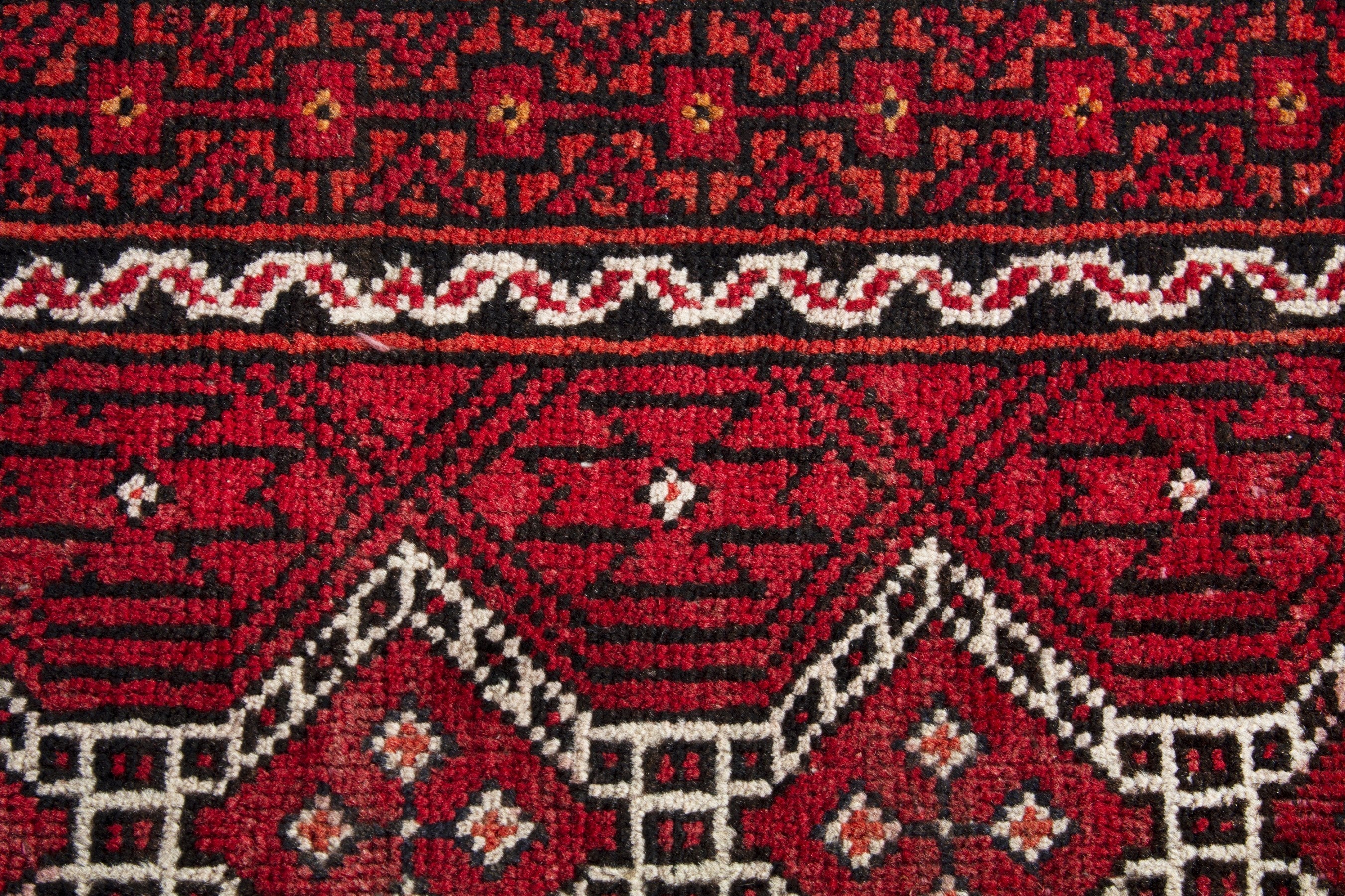 Persian Baluch runner rug in deep red and cream, view 12 of 17