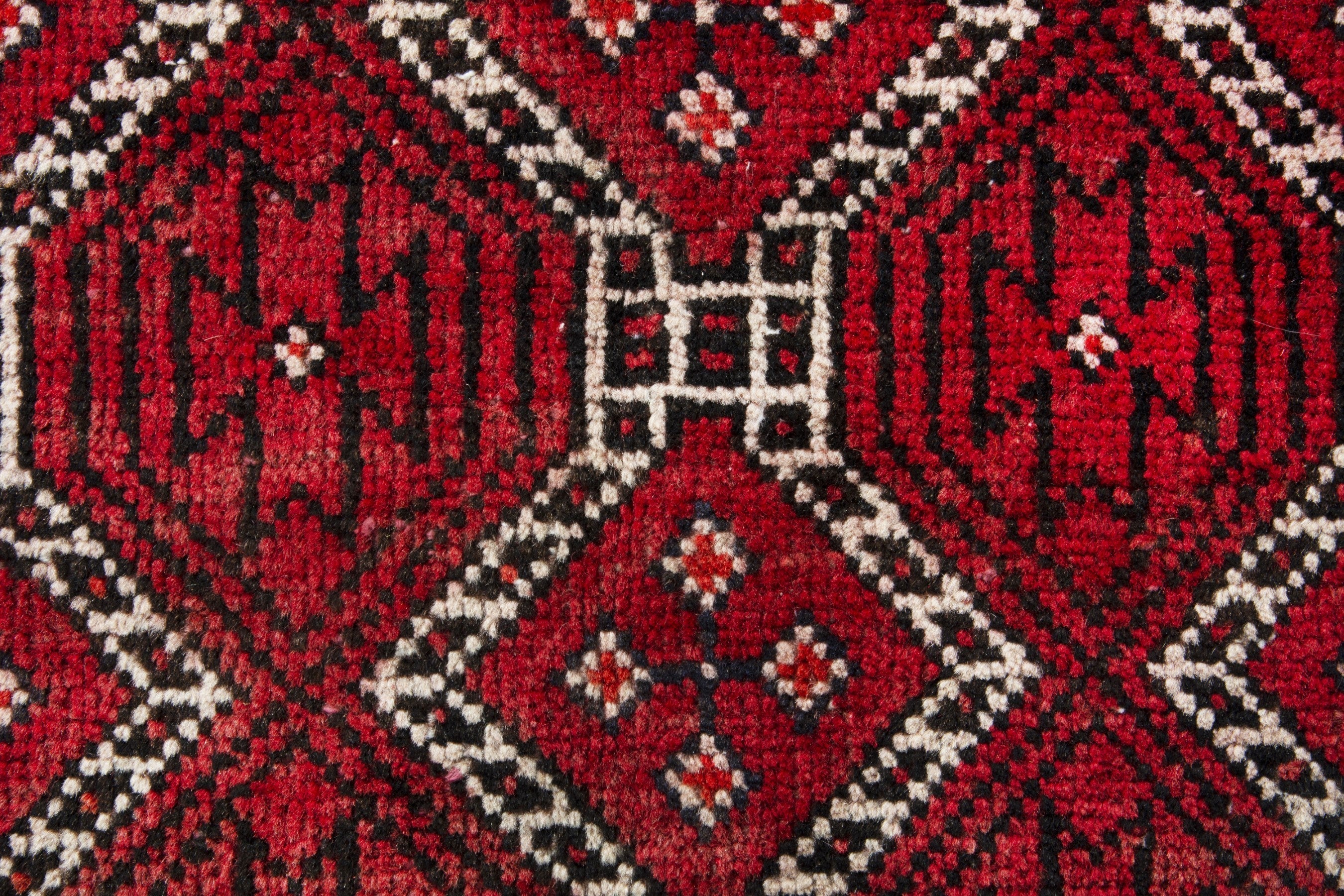 Persian Baluch runner rug in deep red and cream, view 13 of 17