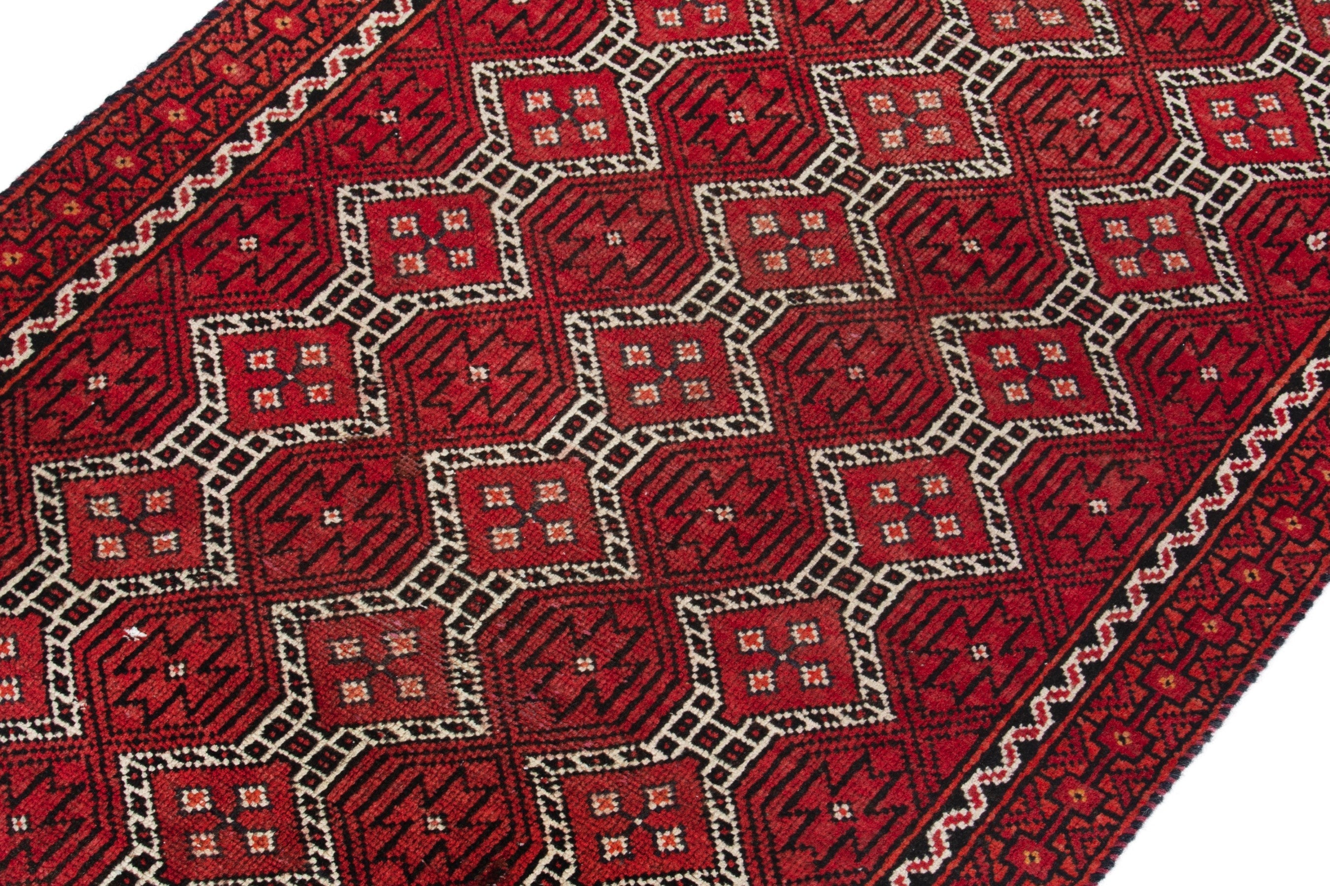 Persian Baluch runner rug in deep red and cream, view 6 of 17