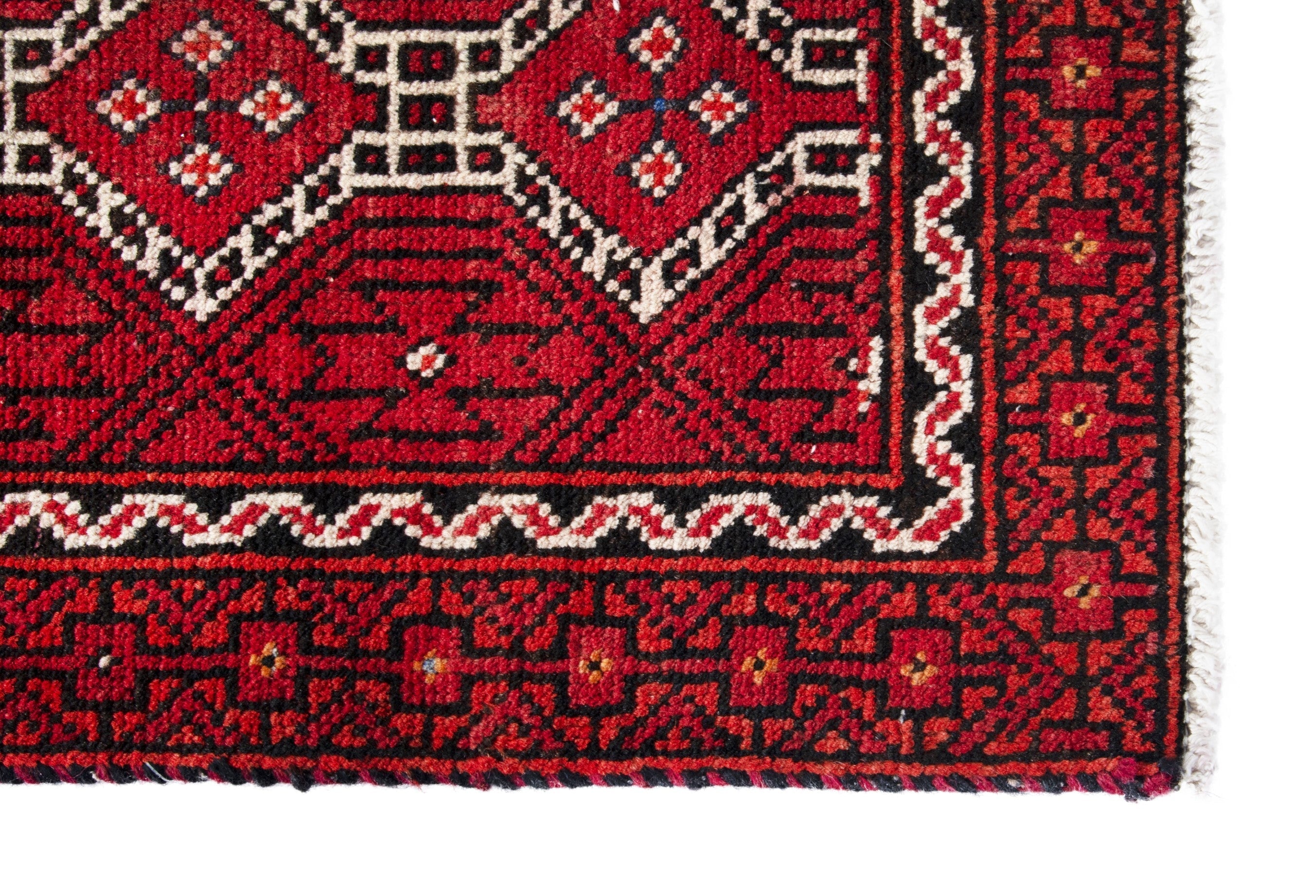 Persian Baluch runner rug in deep red and cream, view 5 of 17