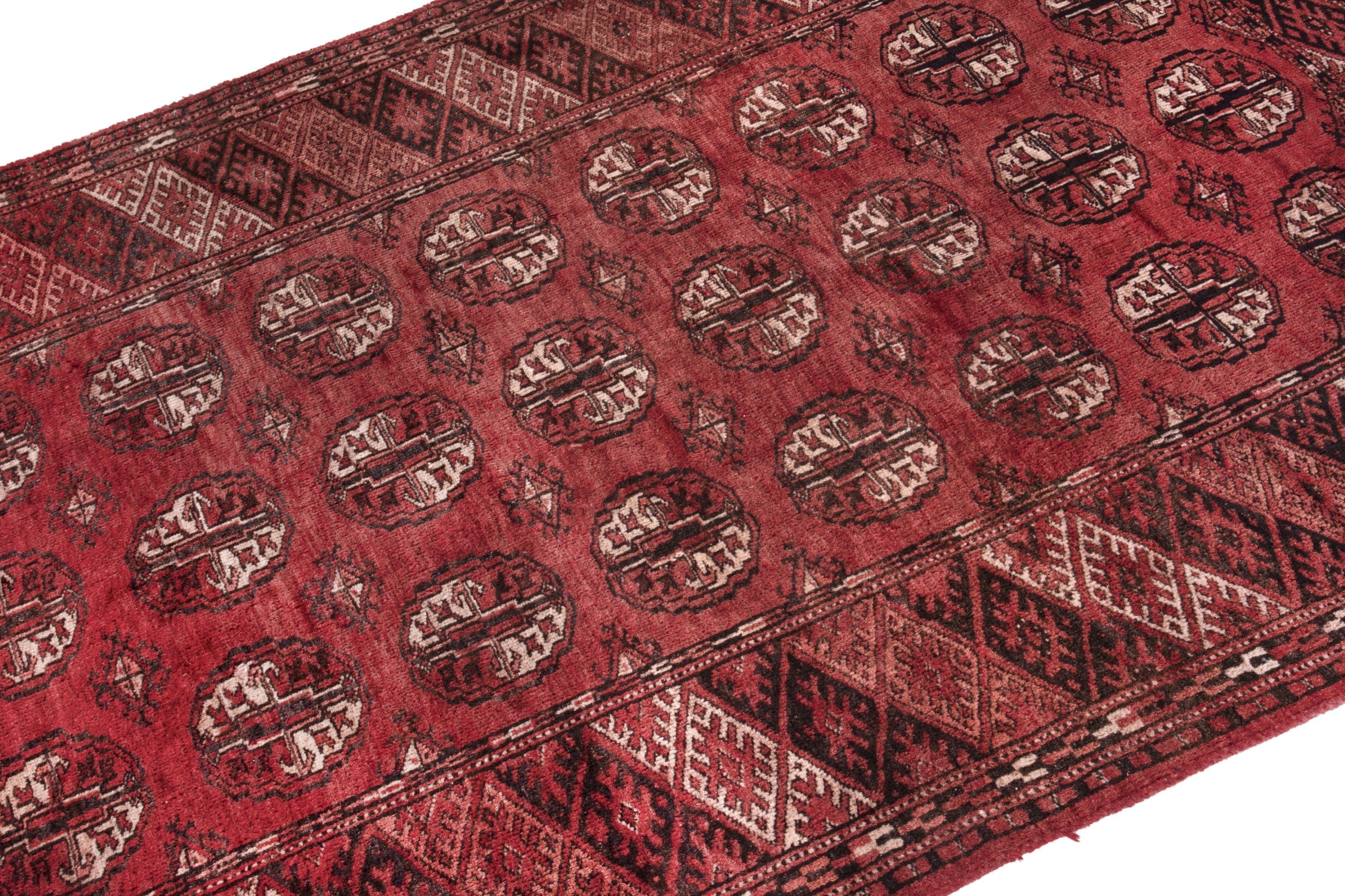 Persian Torkaman accent rug in deep red and faded red, view 6 of 17