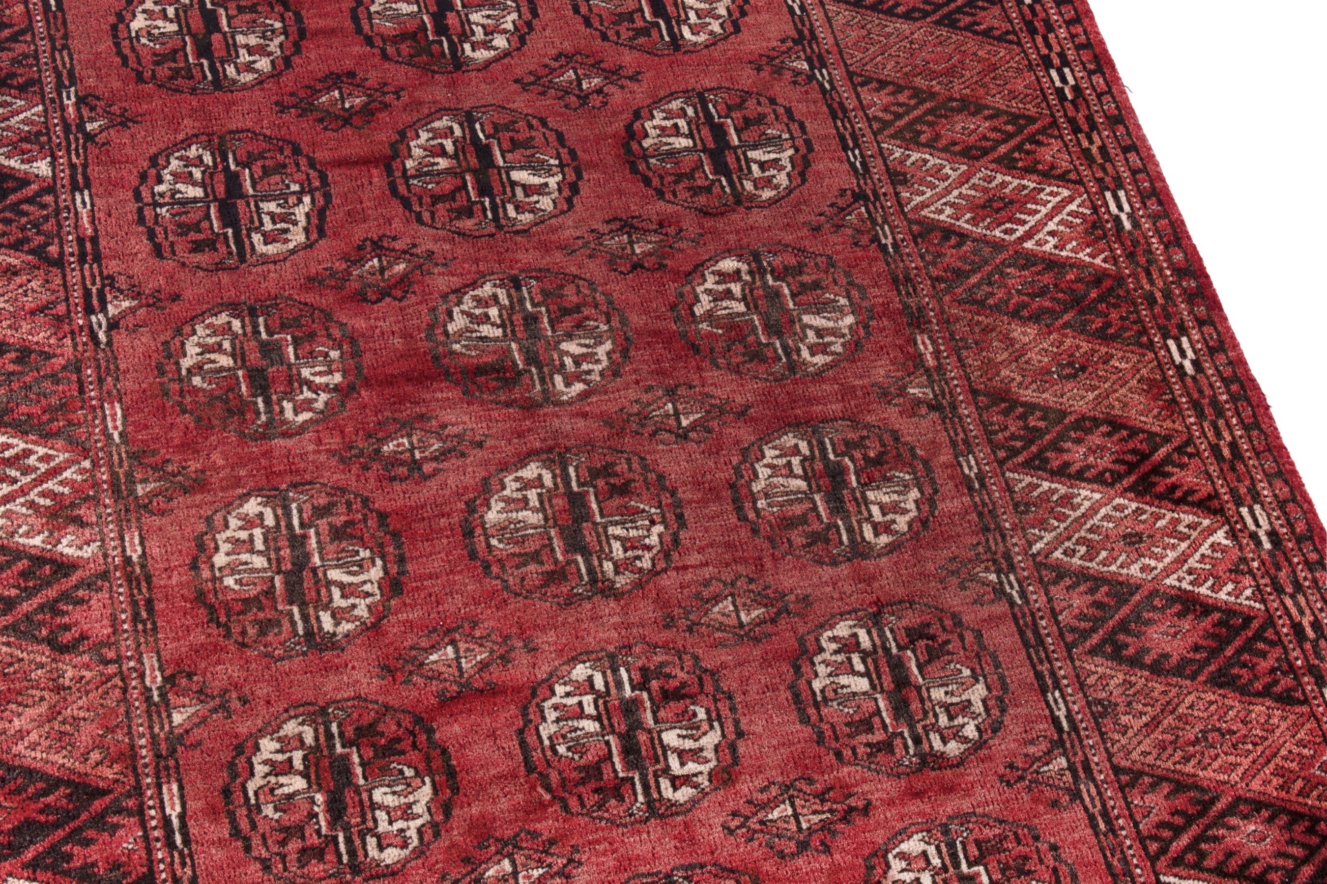 Persian Torkaman accent rug in deep red and faded red, view 7 of 17