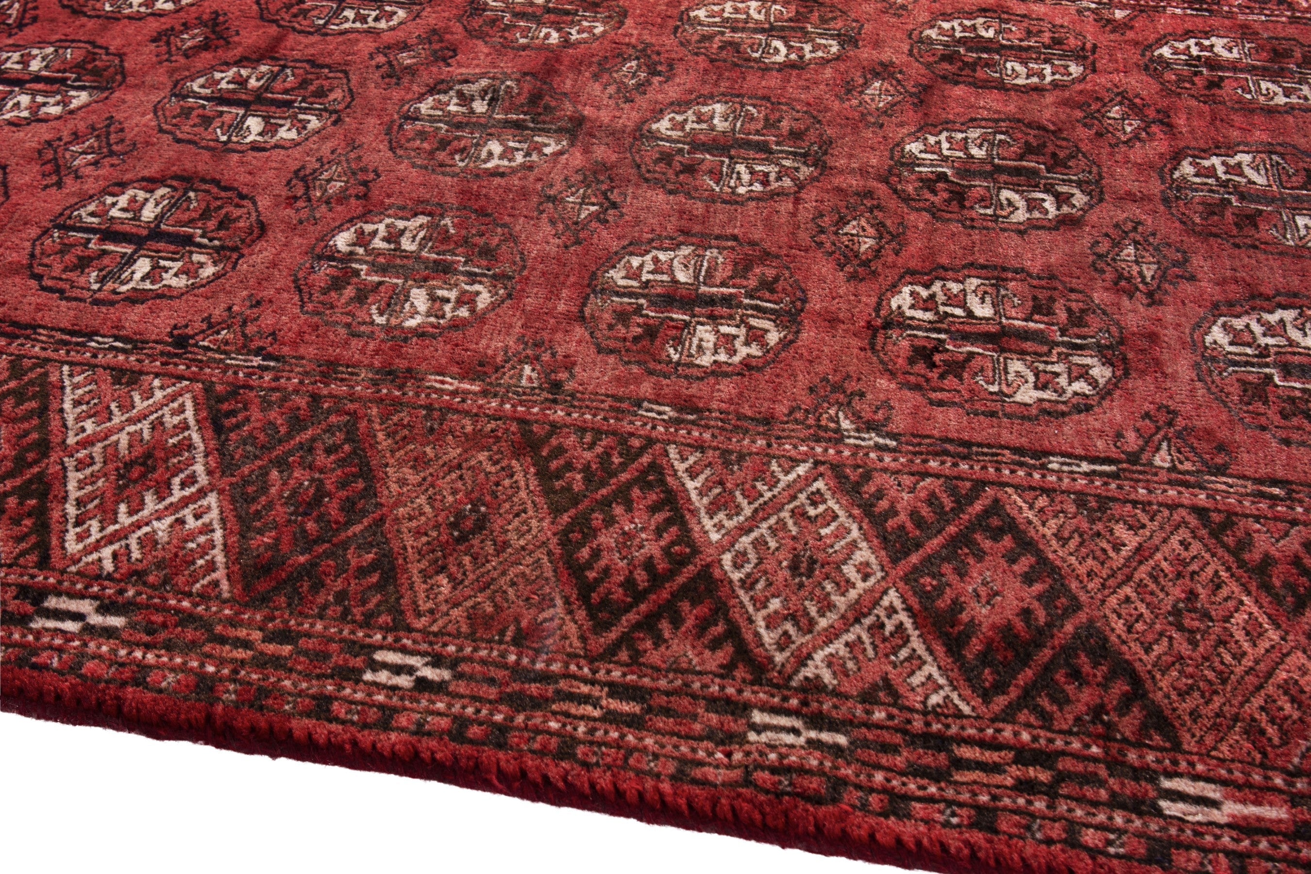 Persian Torkaman accent rug in deep red and faded red, view 8 of 17