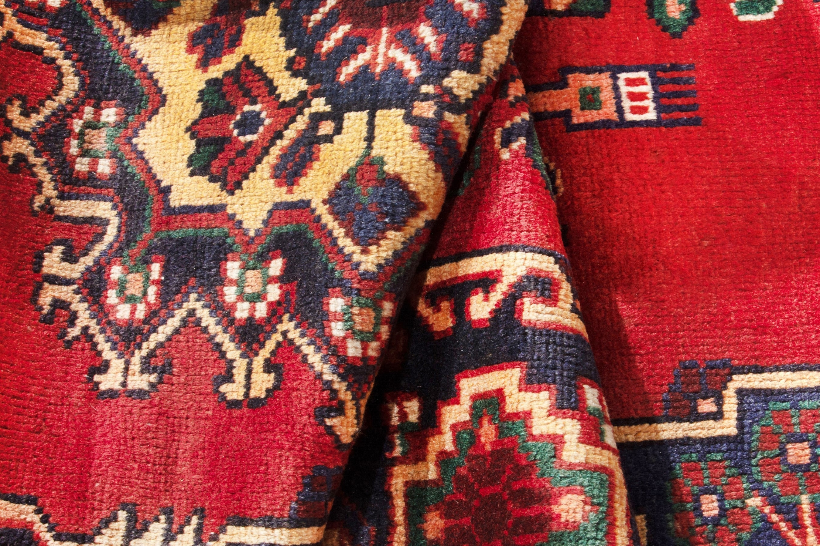 Persian Ferdos area rug in deep red and navy, view 14 of 17