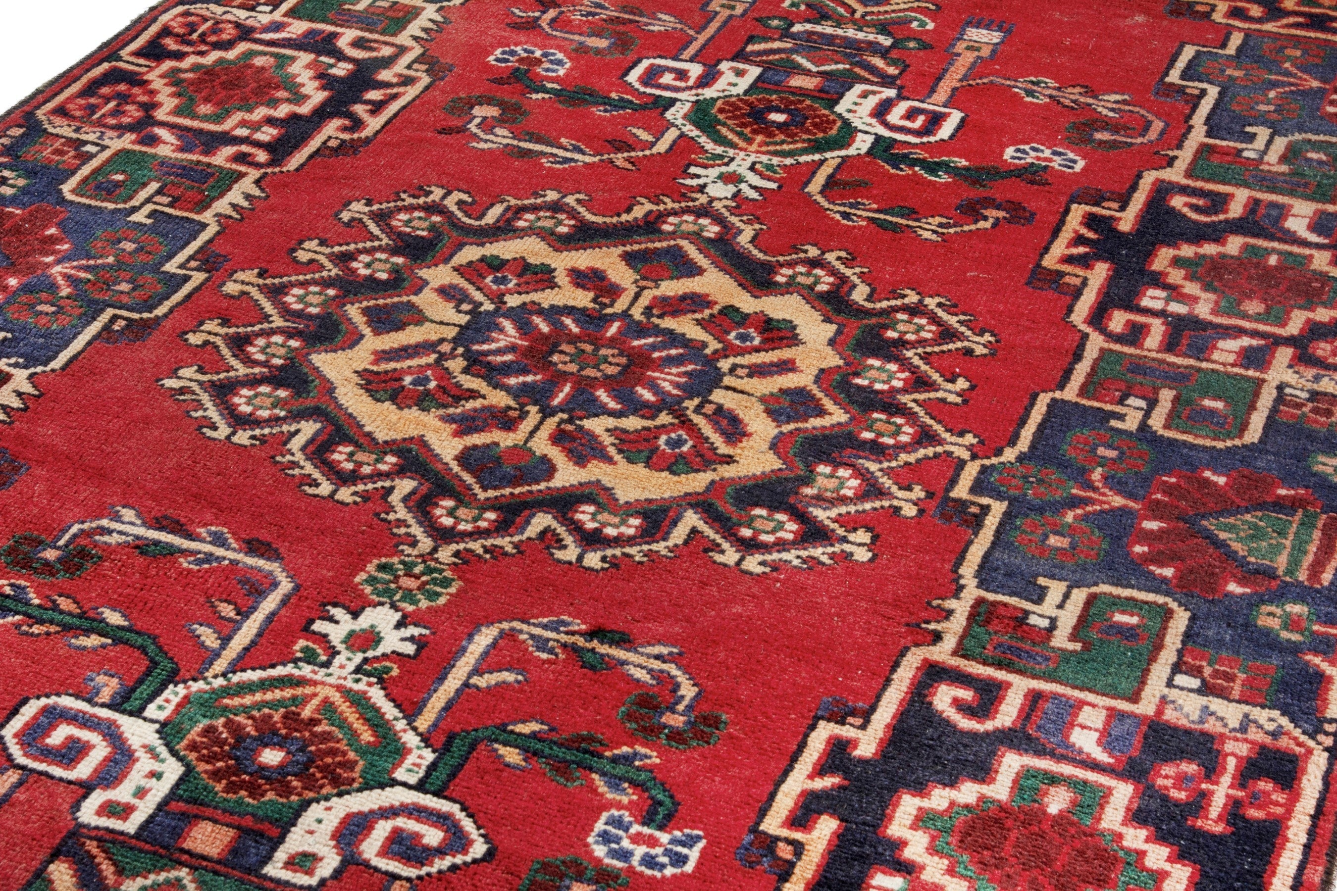 Persian Ferdos area rug in deep red and navy, view 9 of 17
