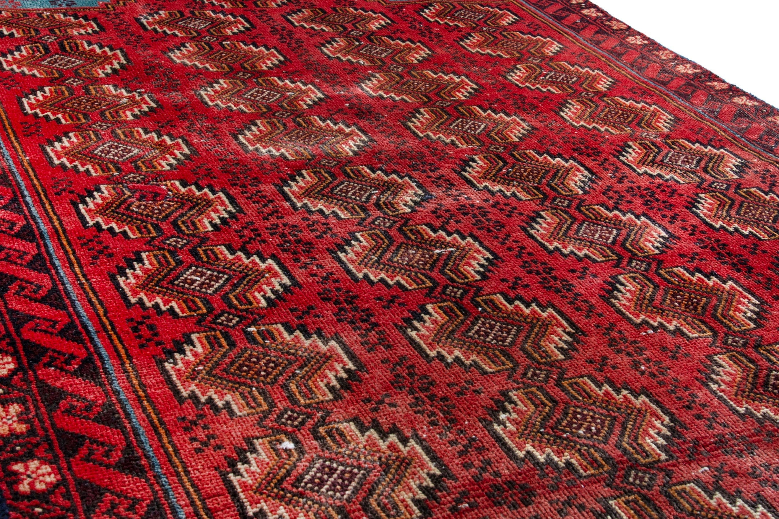 Persian Torkaman accent rug in deep red and faded red, view 10 of 17