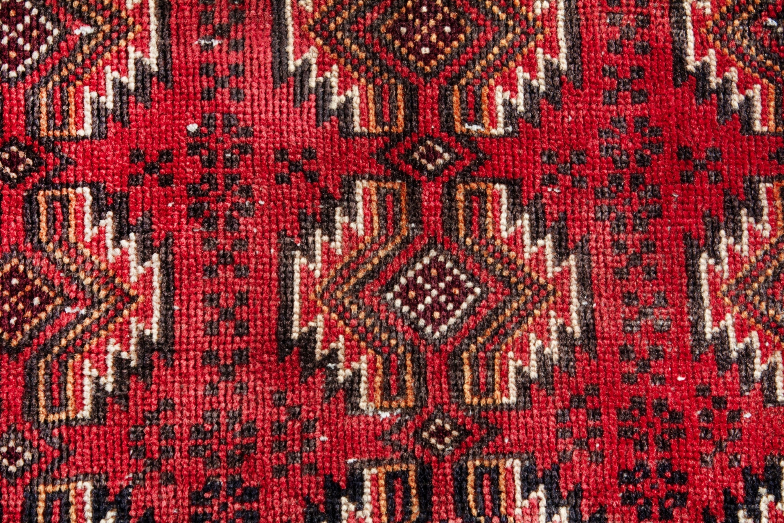 Persian Torkaman accent rug in deep red and faded red, view 11 of 17