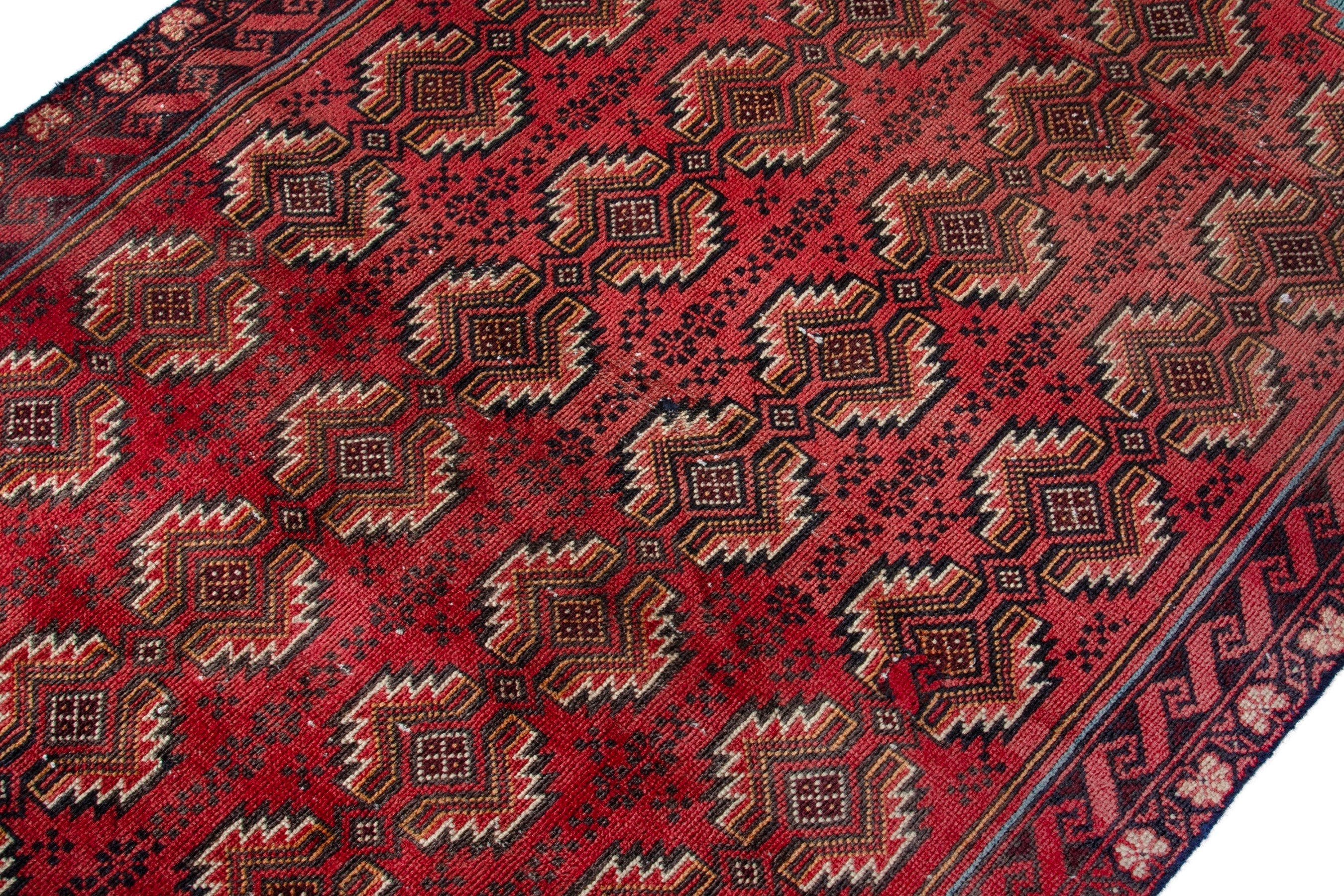 Persian Torkaman accent rug in deep red and faded red, view 6 of 17