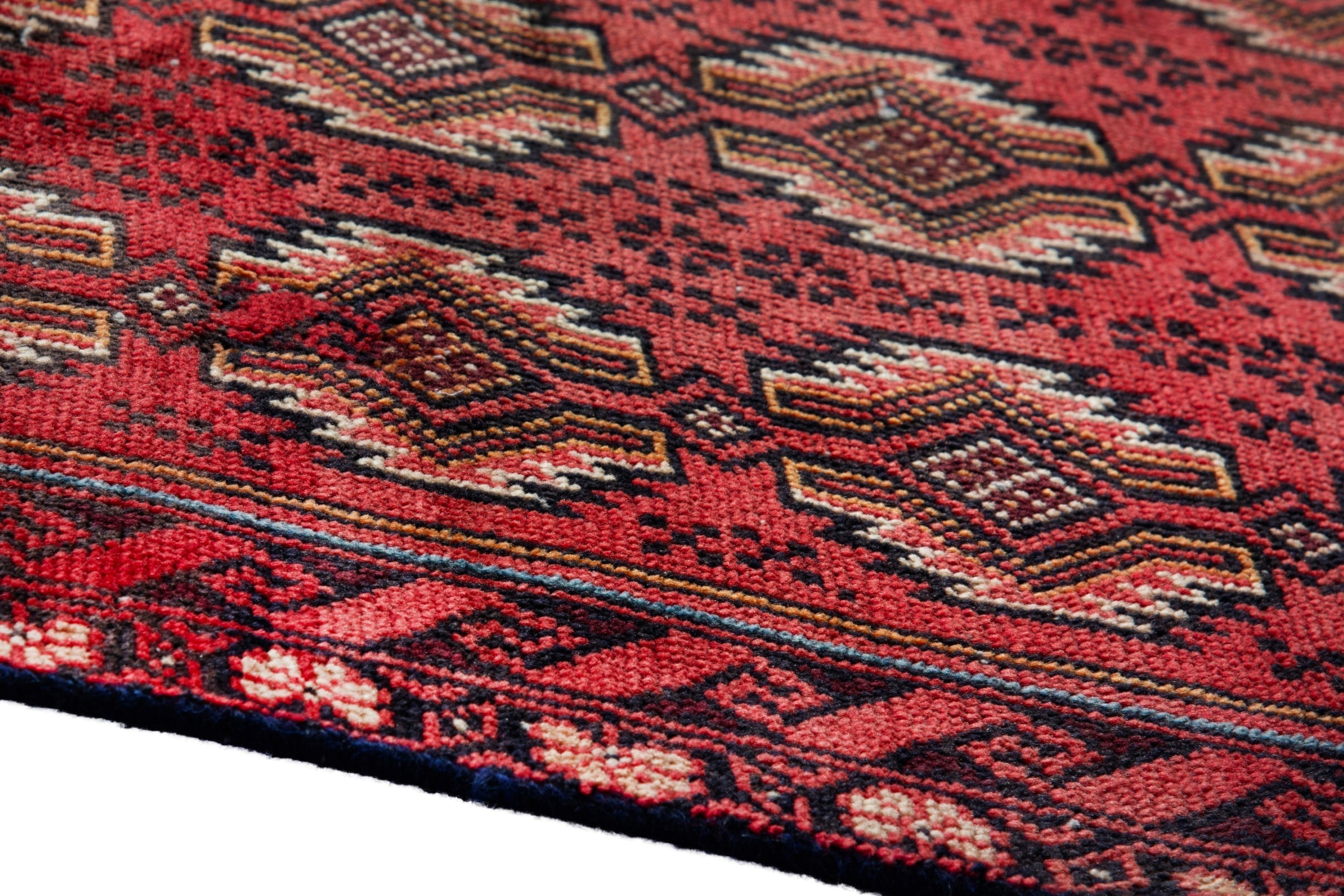 Persian Torkaman accent rug in deep red and faded red, view 8 of 17