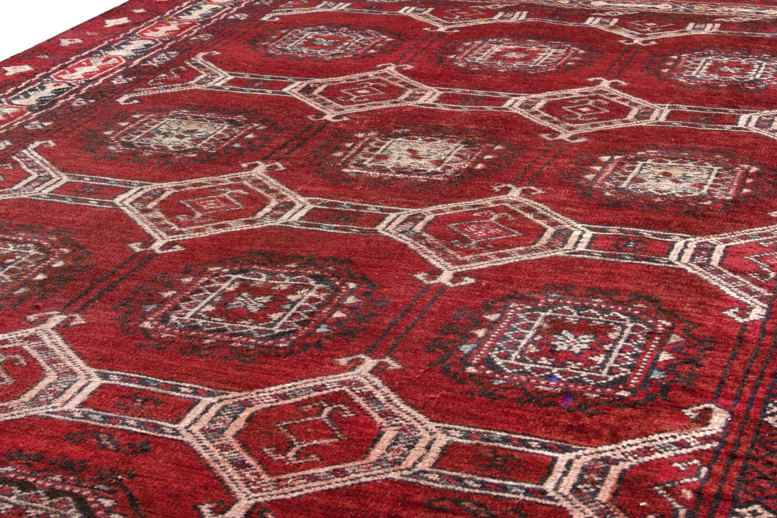 Persian Torkaman accent rug in deep red and cream, view 10 of 17