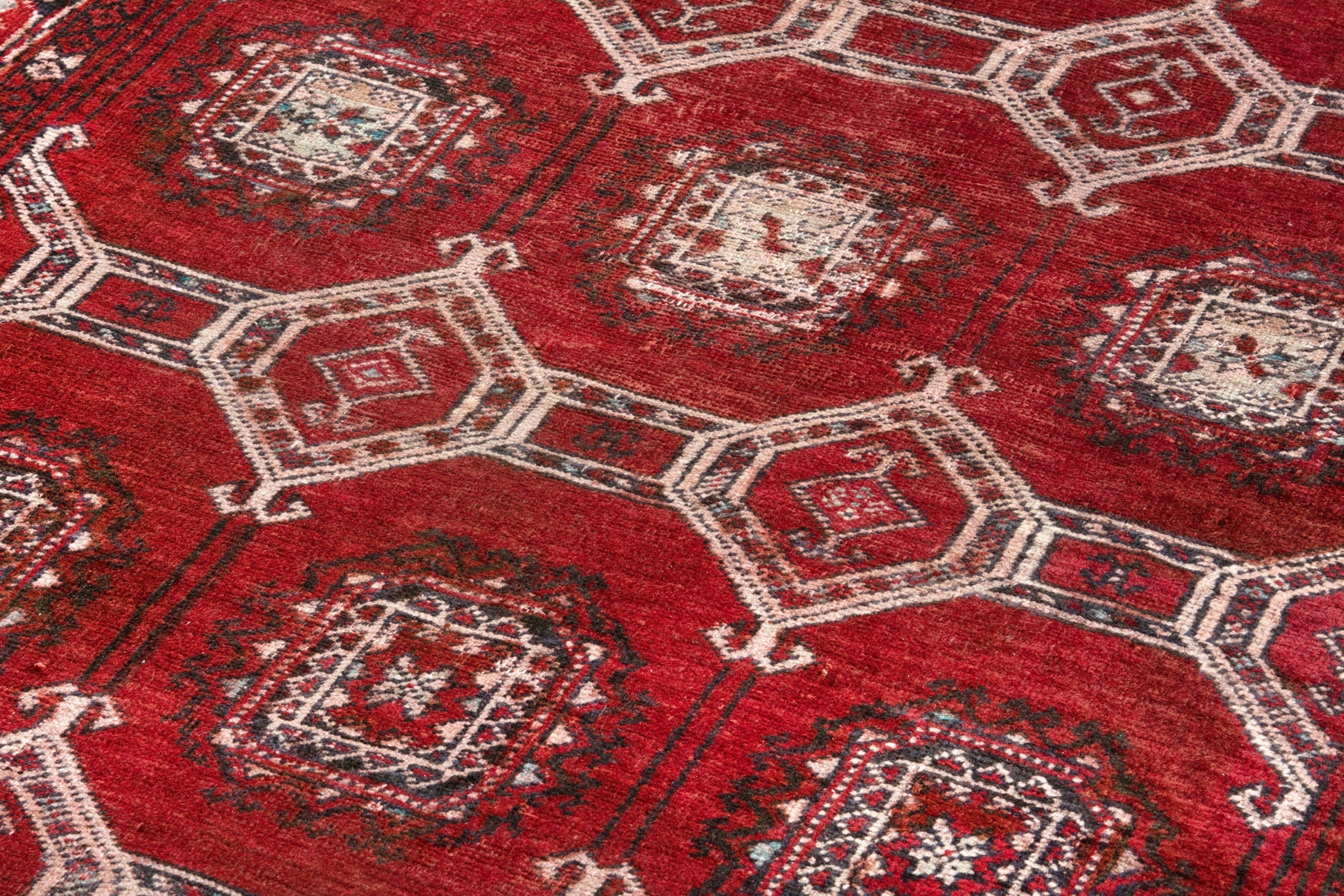 Persian Torkaman accent rug in deep red and cream, view 9 of 17