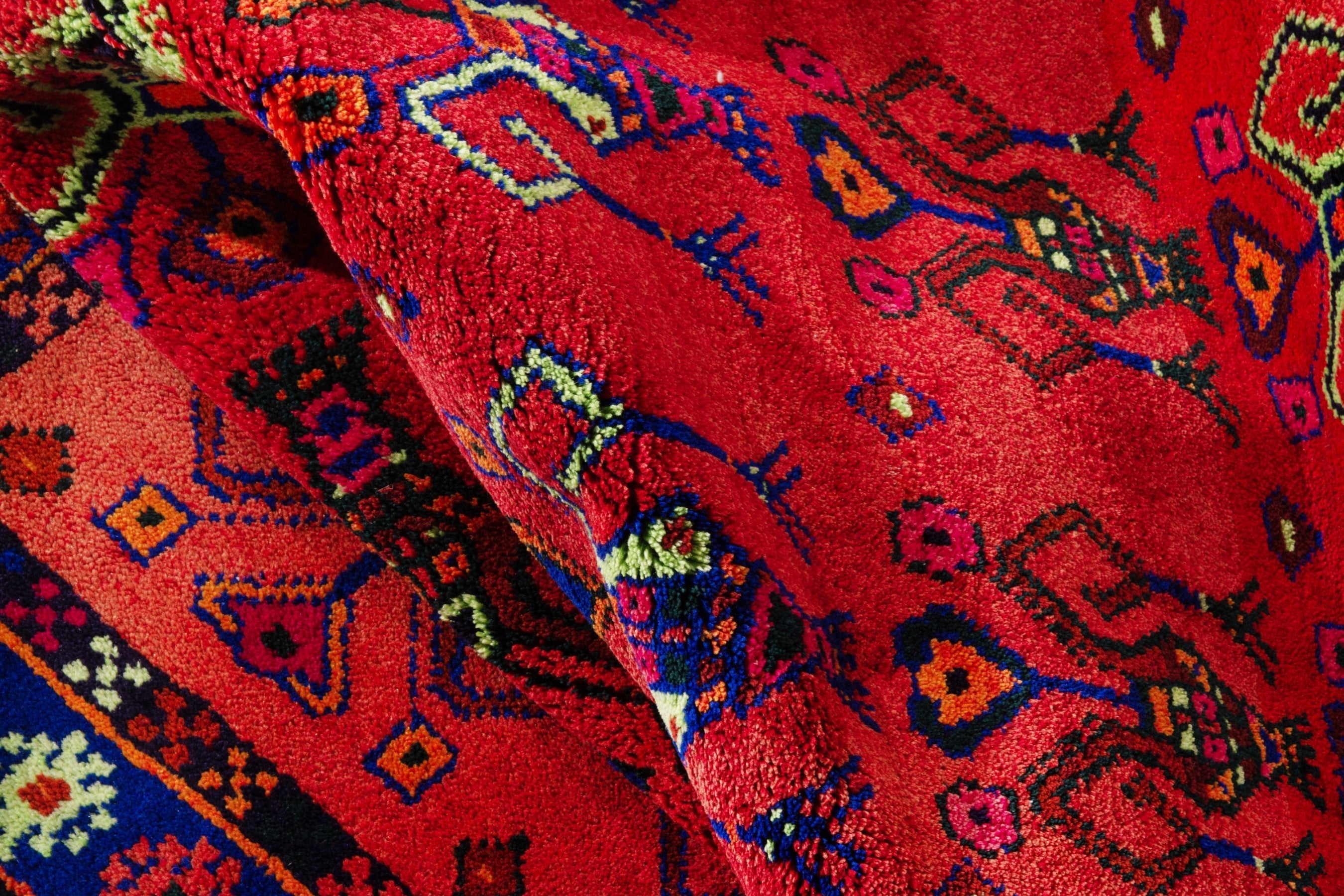 Persian Lori accent rug in deep red and navy, view 17 of 18