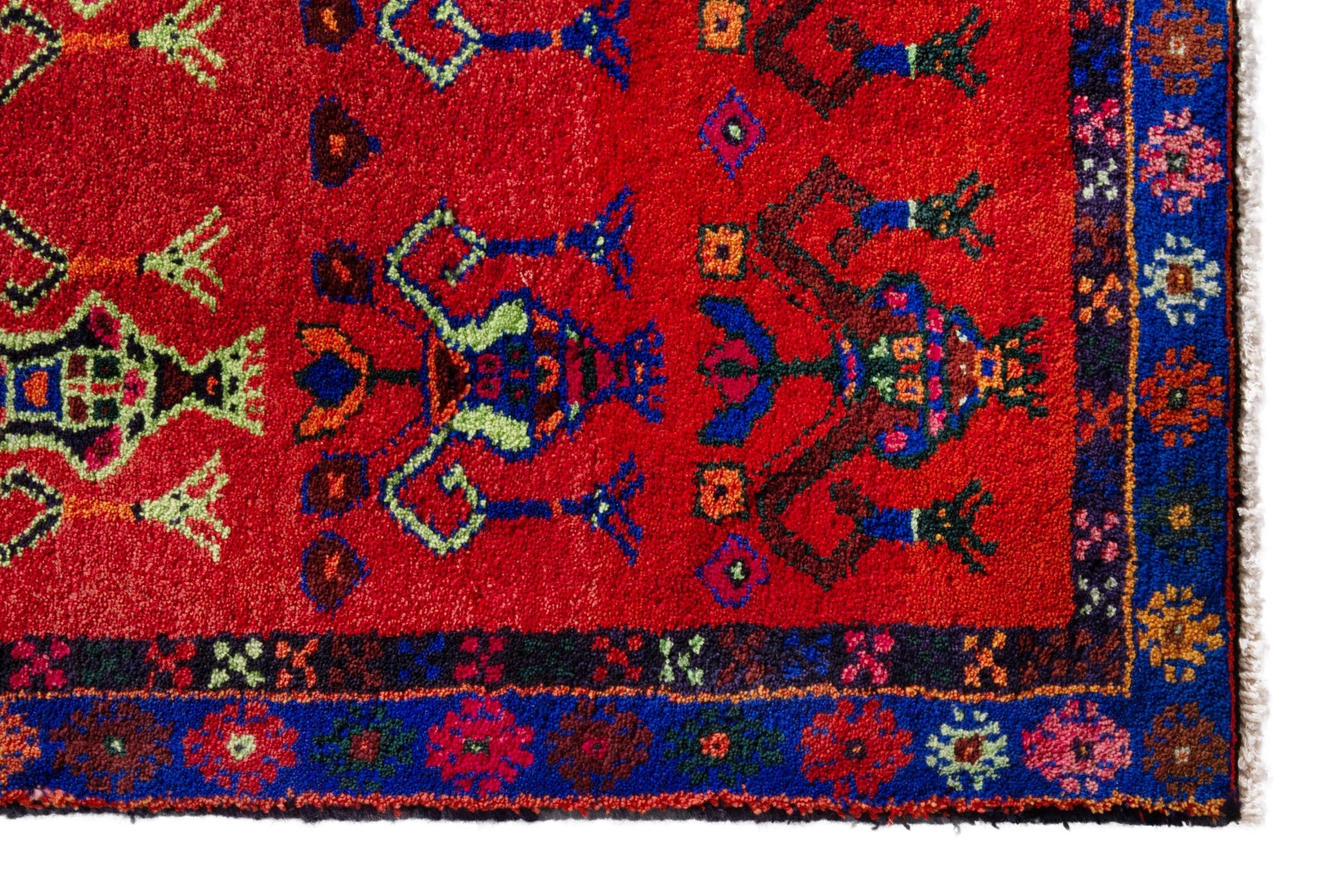 Persian Lori accent rug in deep red and navy, view 5 of 18
