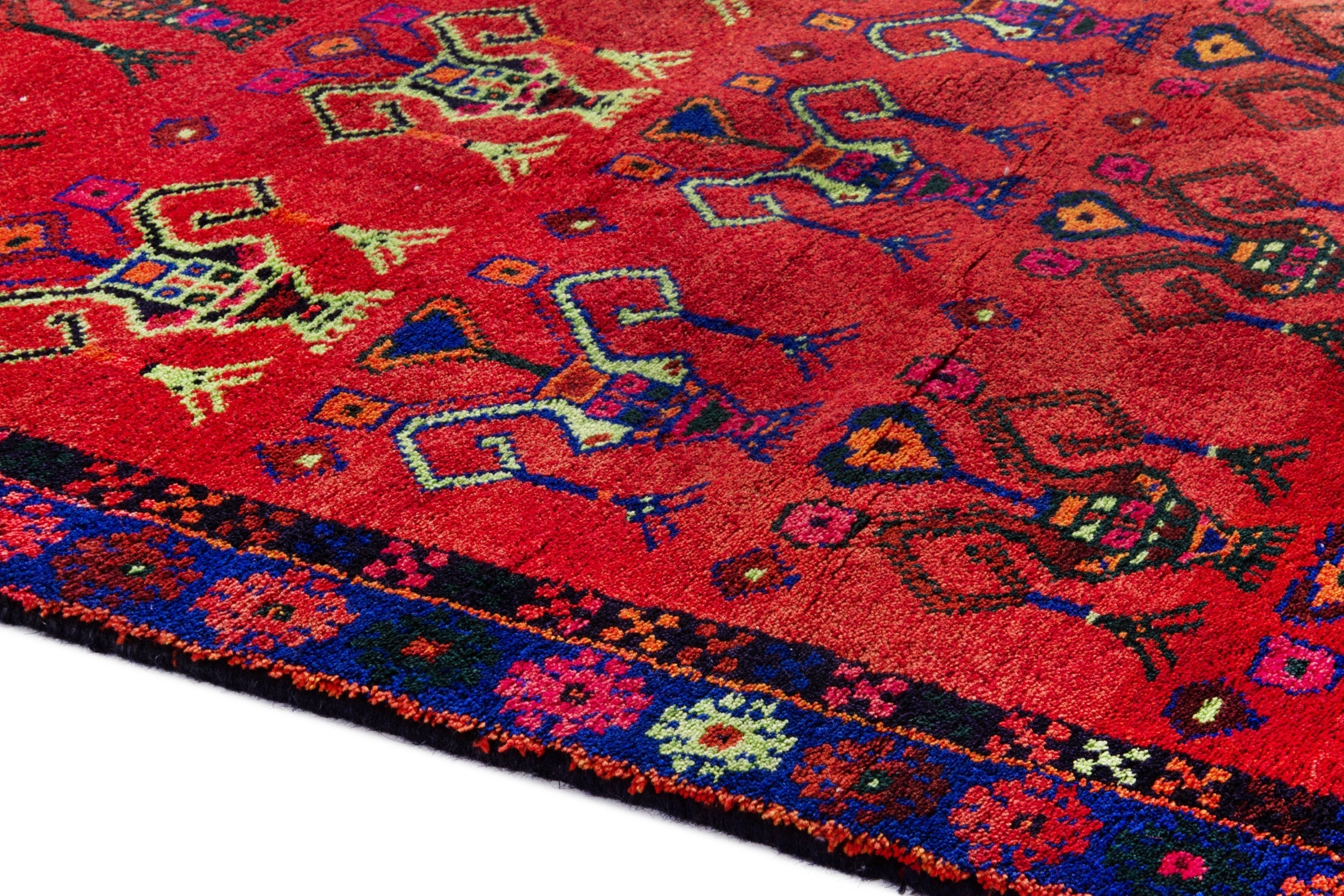 Persian Lori accent rug in deep red and navy, view 8 of 18