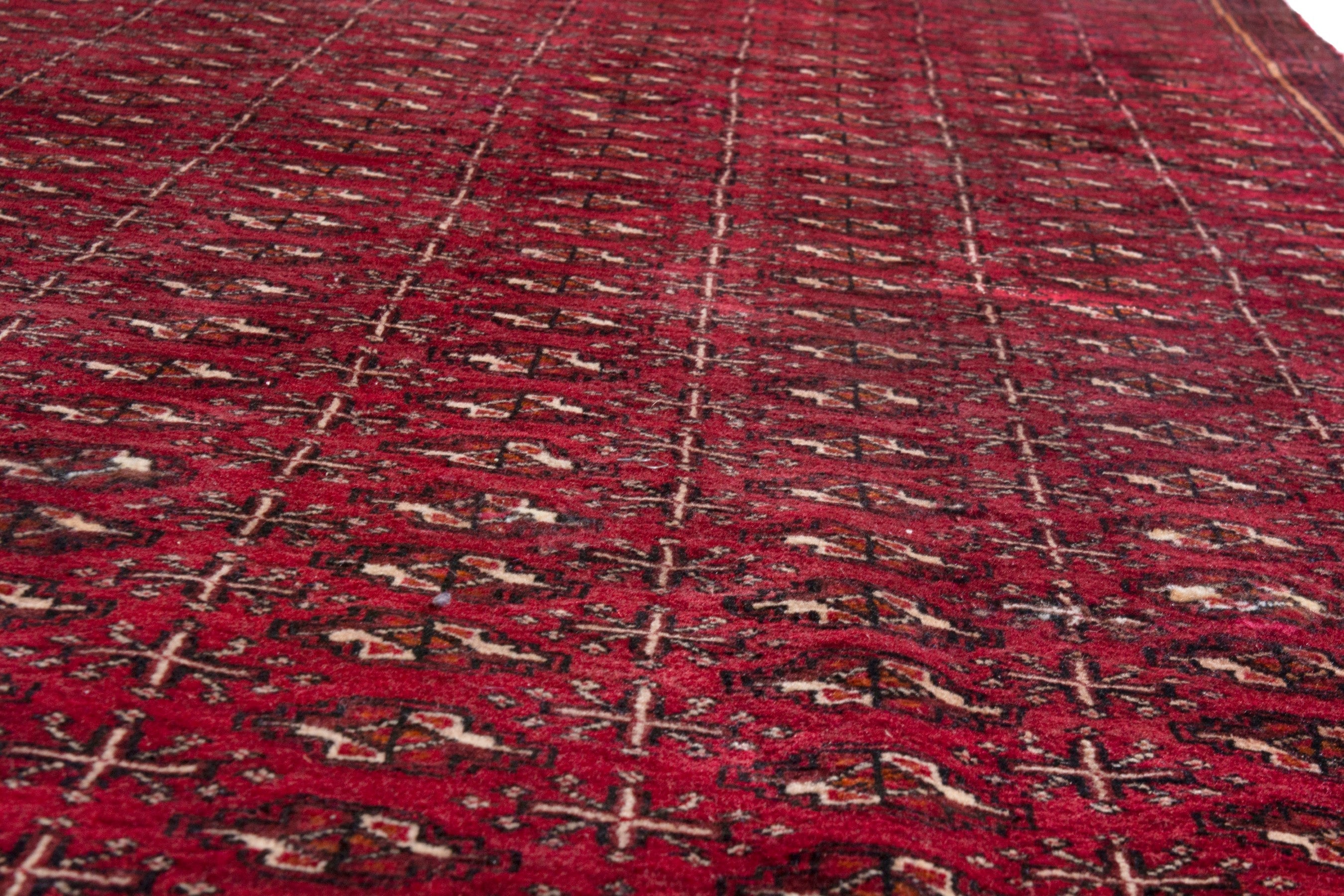 Persian Torkaman area rug in burgundy and deep red, view 11 of 21