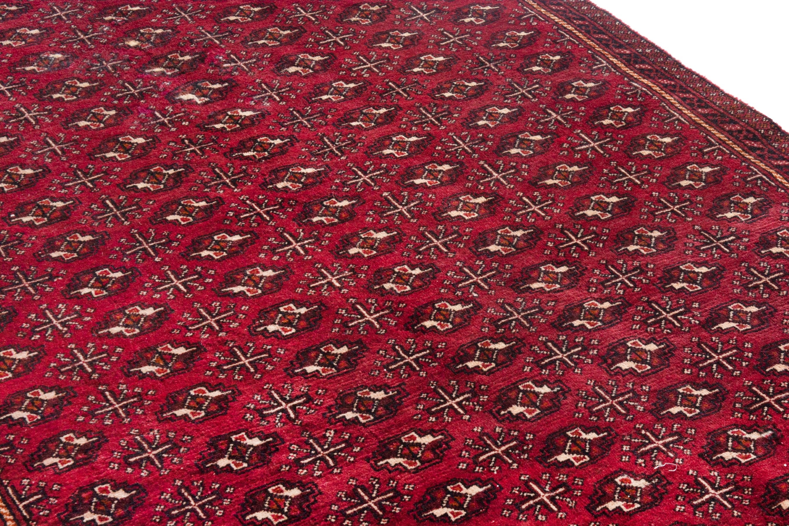 Persian Torkaman area rug in burgundy and deep red, view 9 of 21