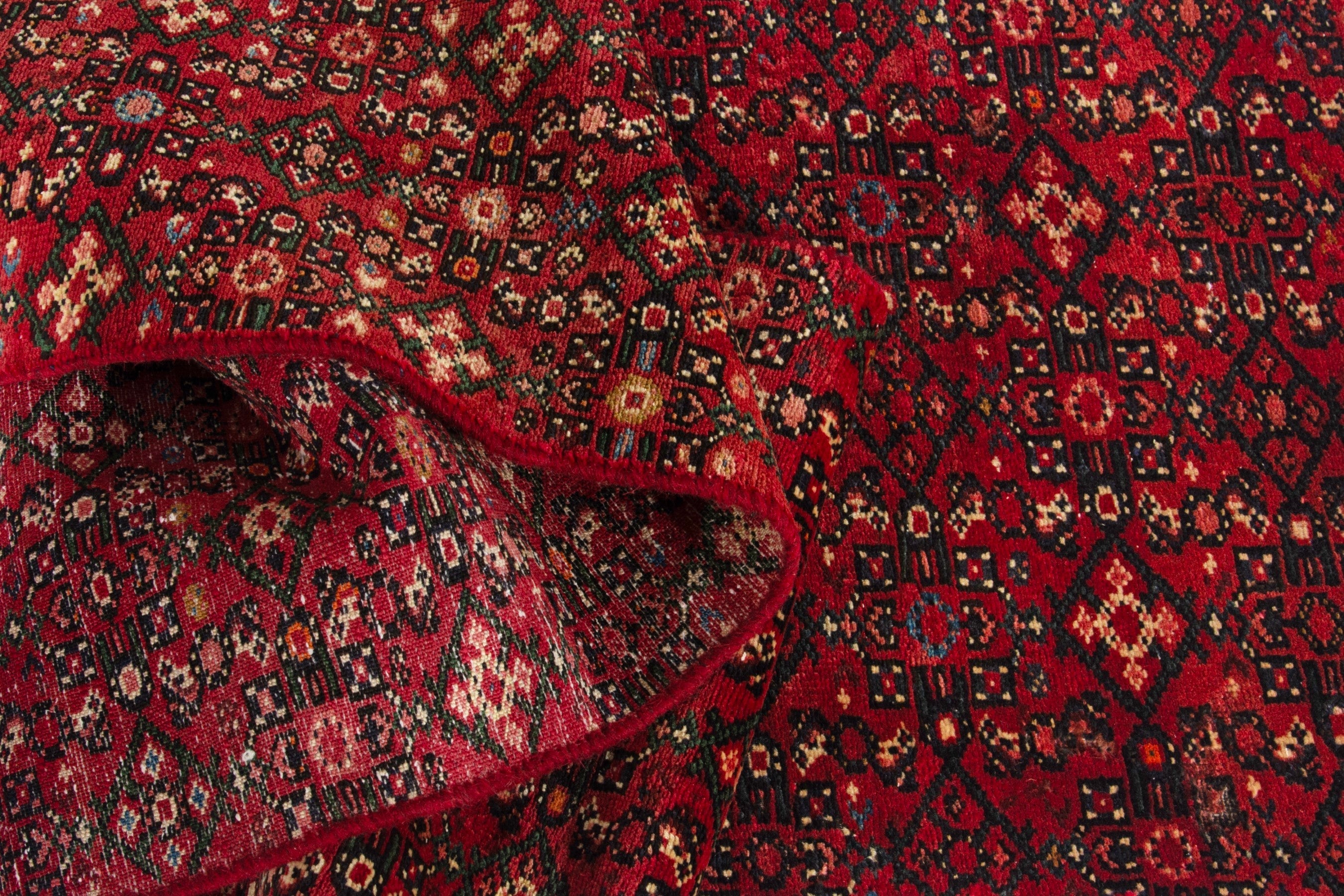 Persian Hosseinabad runner rug in deep red and cream, view 16 of 17
