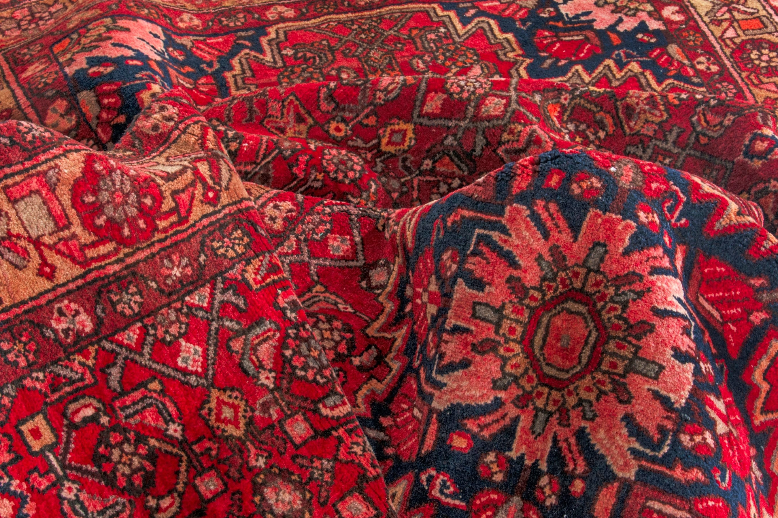 Persian Hosseinabad area rug in deep red and terracotta, view 19 of 20