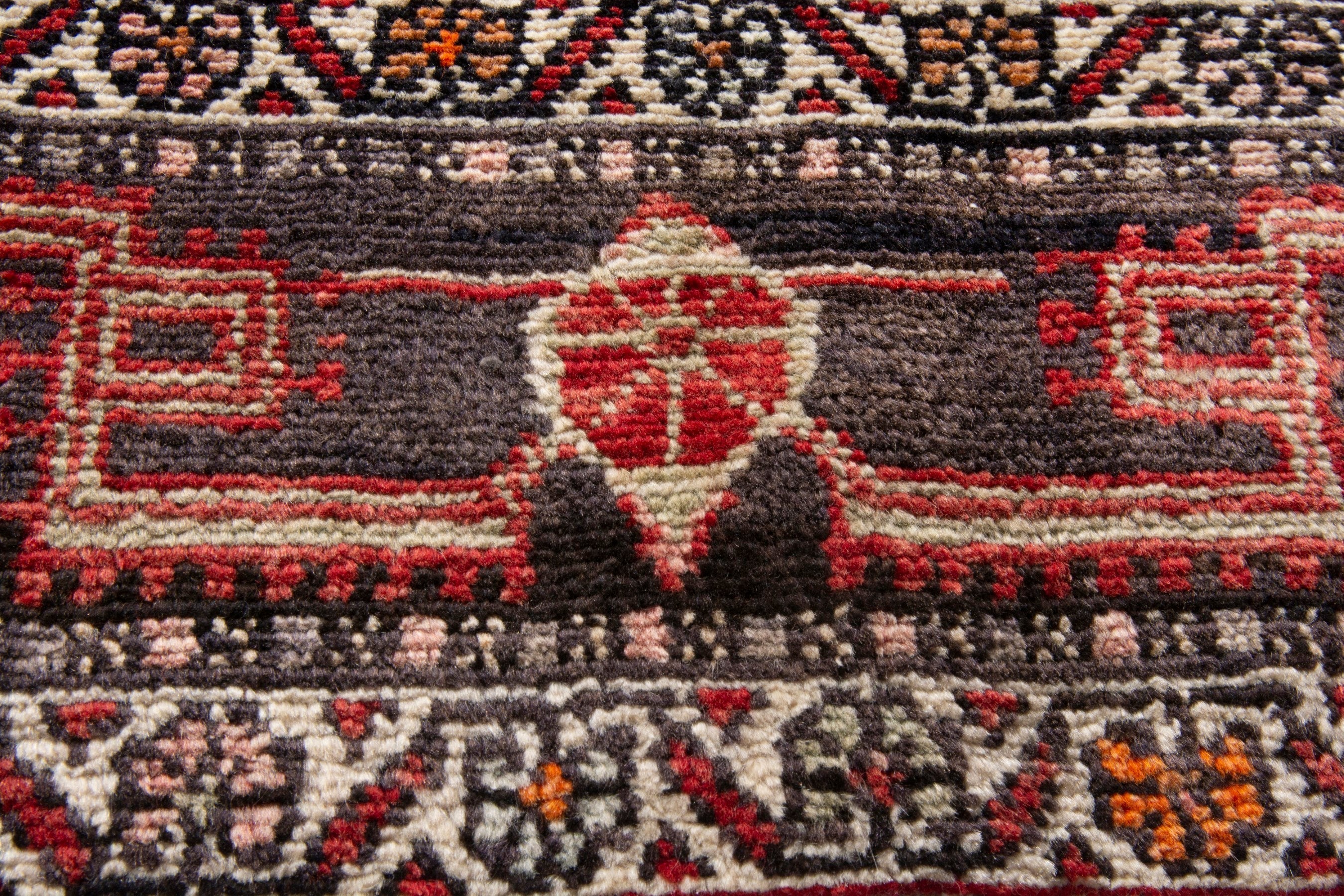 Persian Toyserkan area rug in deep red and cream, view 11 of 21