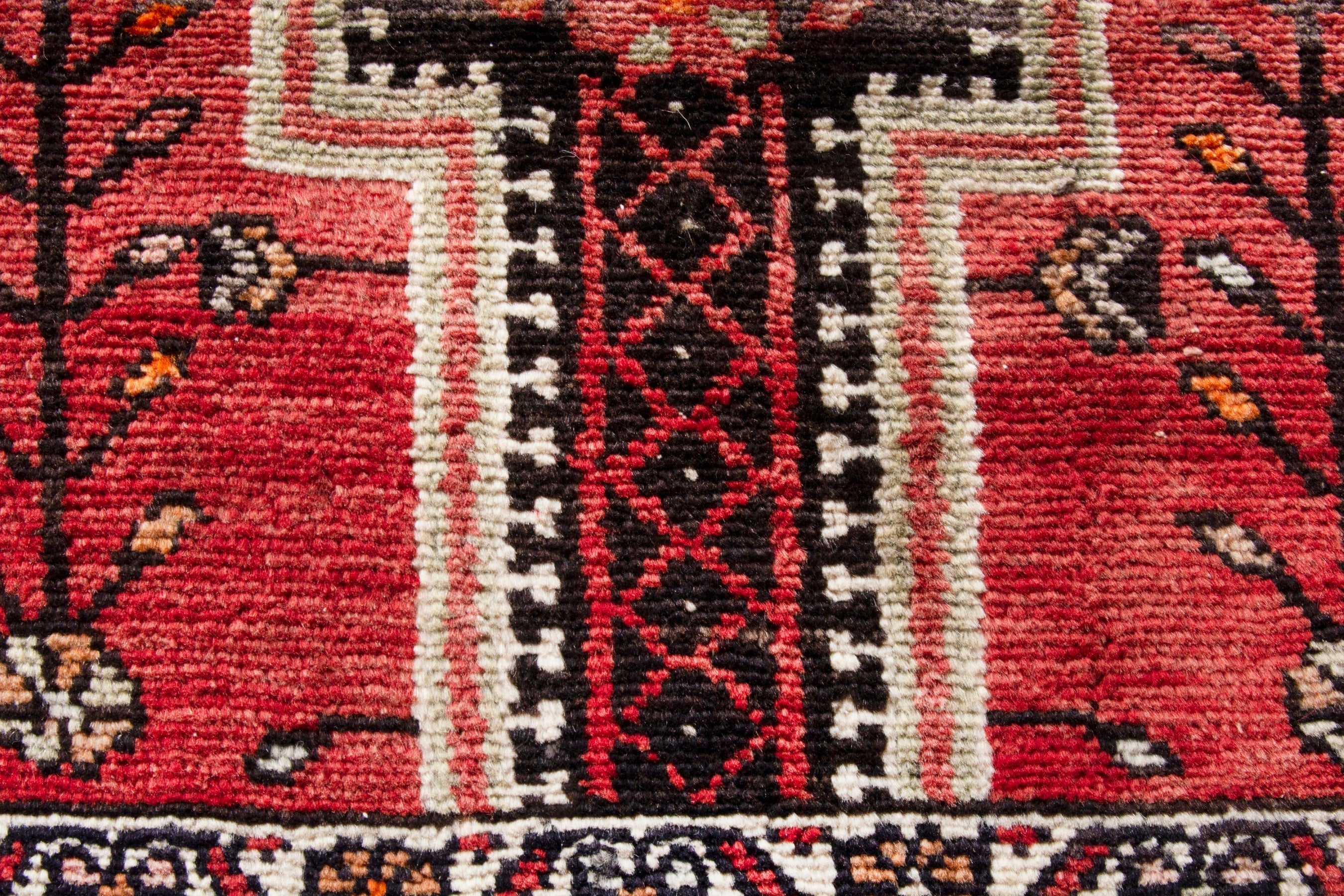 Persian Toyserkan area rug in deep red and cream, view 12 of 21