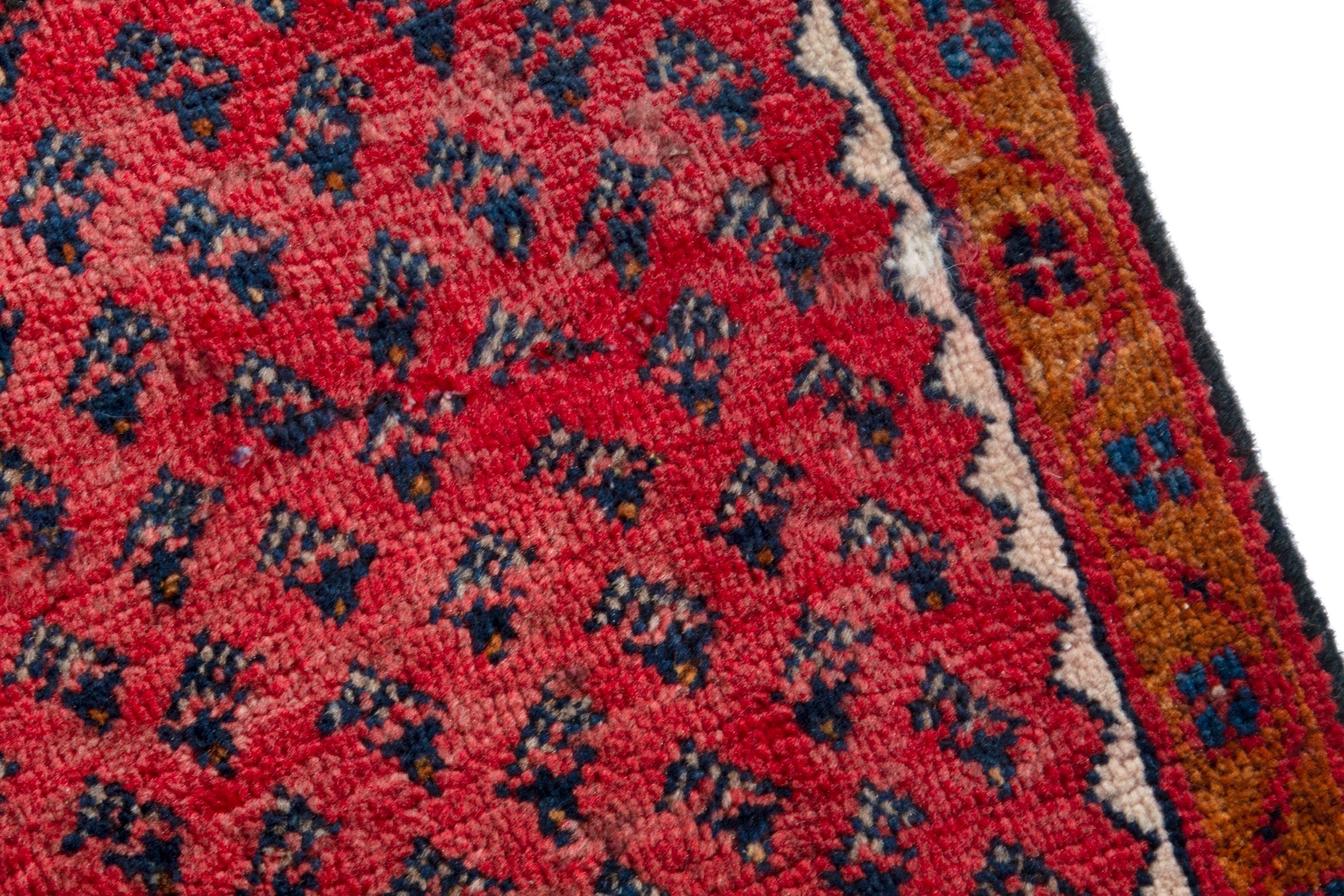 Persian Arak accent rug in deep red and cream, view 9 of 17