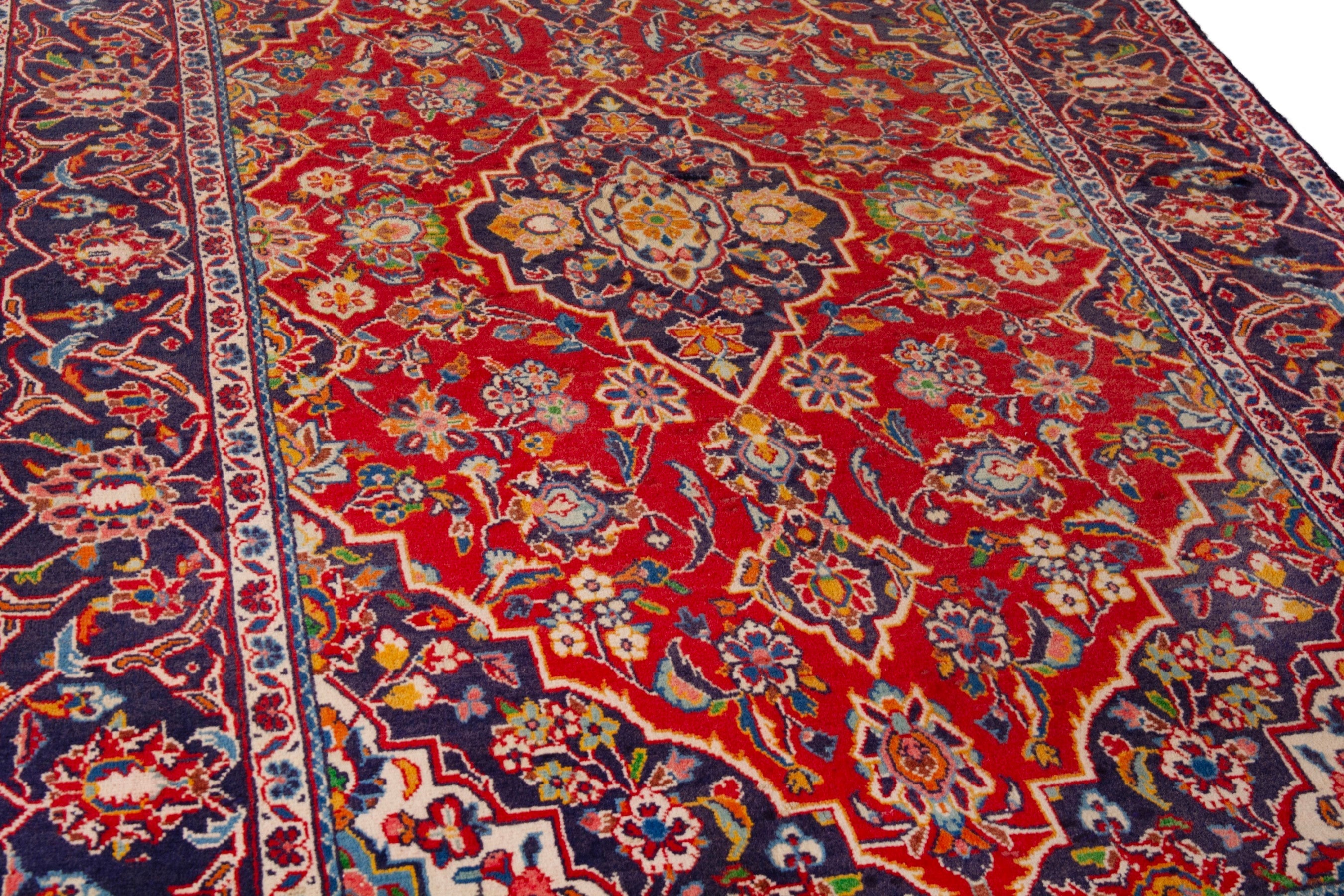 Persian Kashan area rug in deep red and navy, view 8 of 18