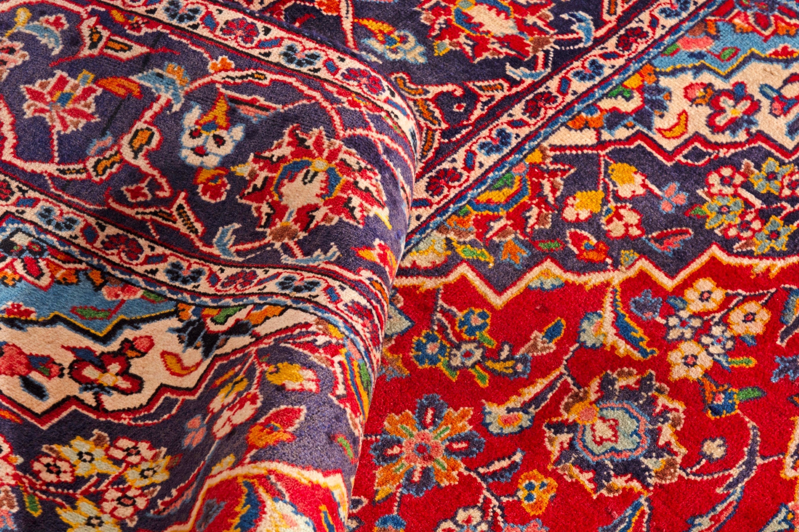 Persian Kashan area rug in deep red and navy, view 15 of 18