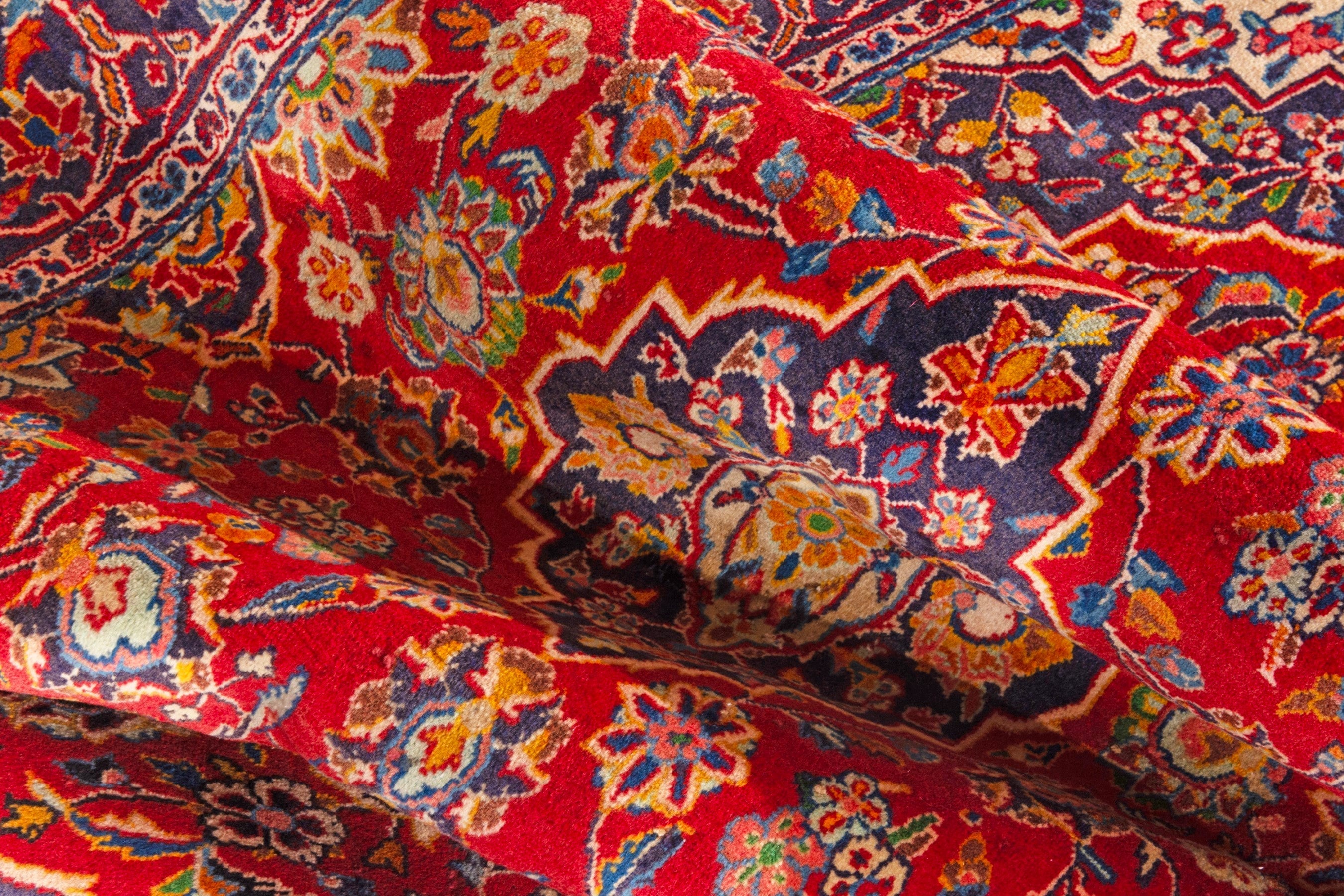 Persian Kashan area rug in deep red and navy, view 16 of 18