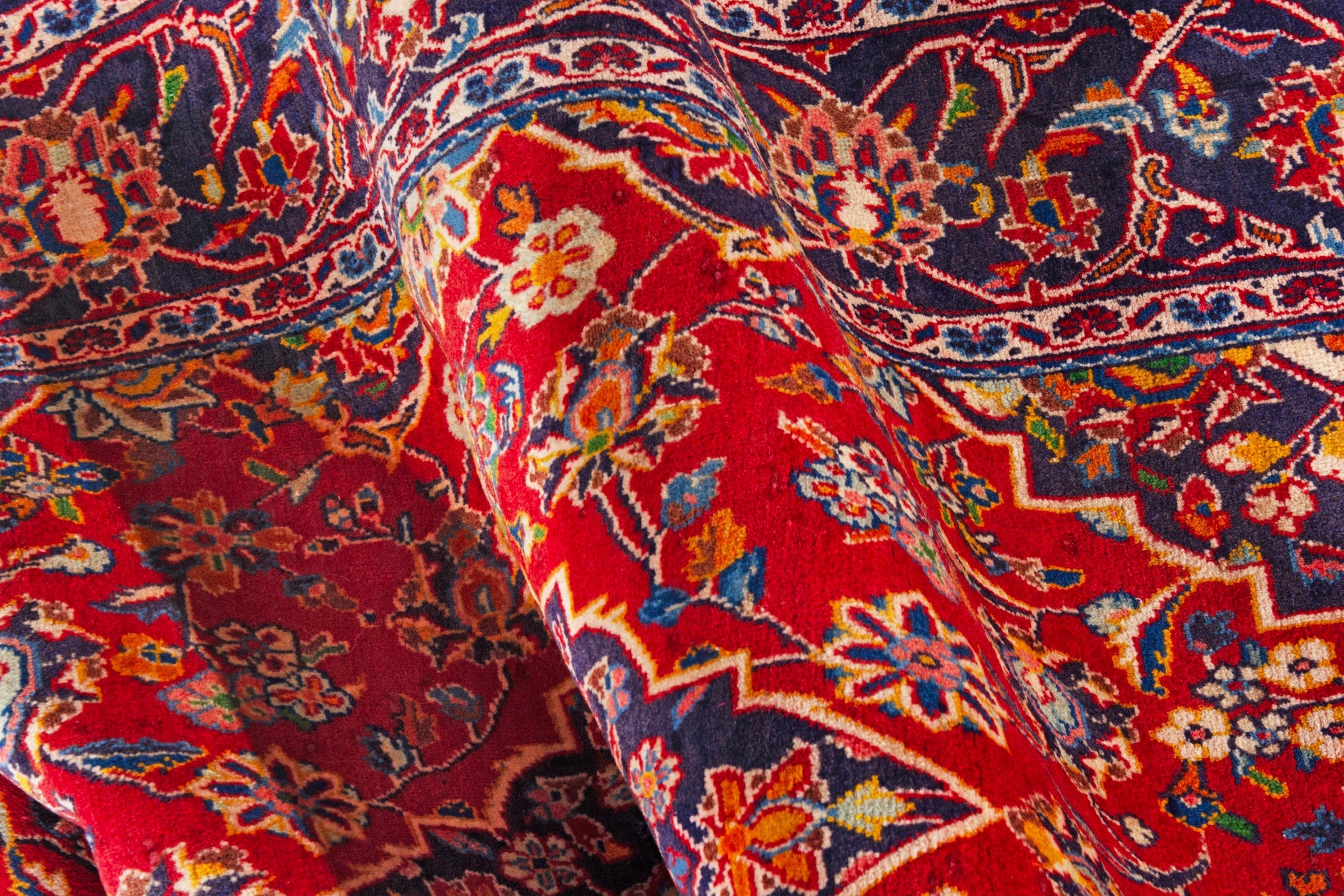 Persian Kashan area rug in deep red and navy, view 17 of 18
