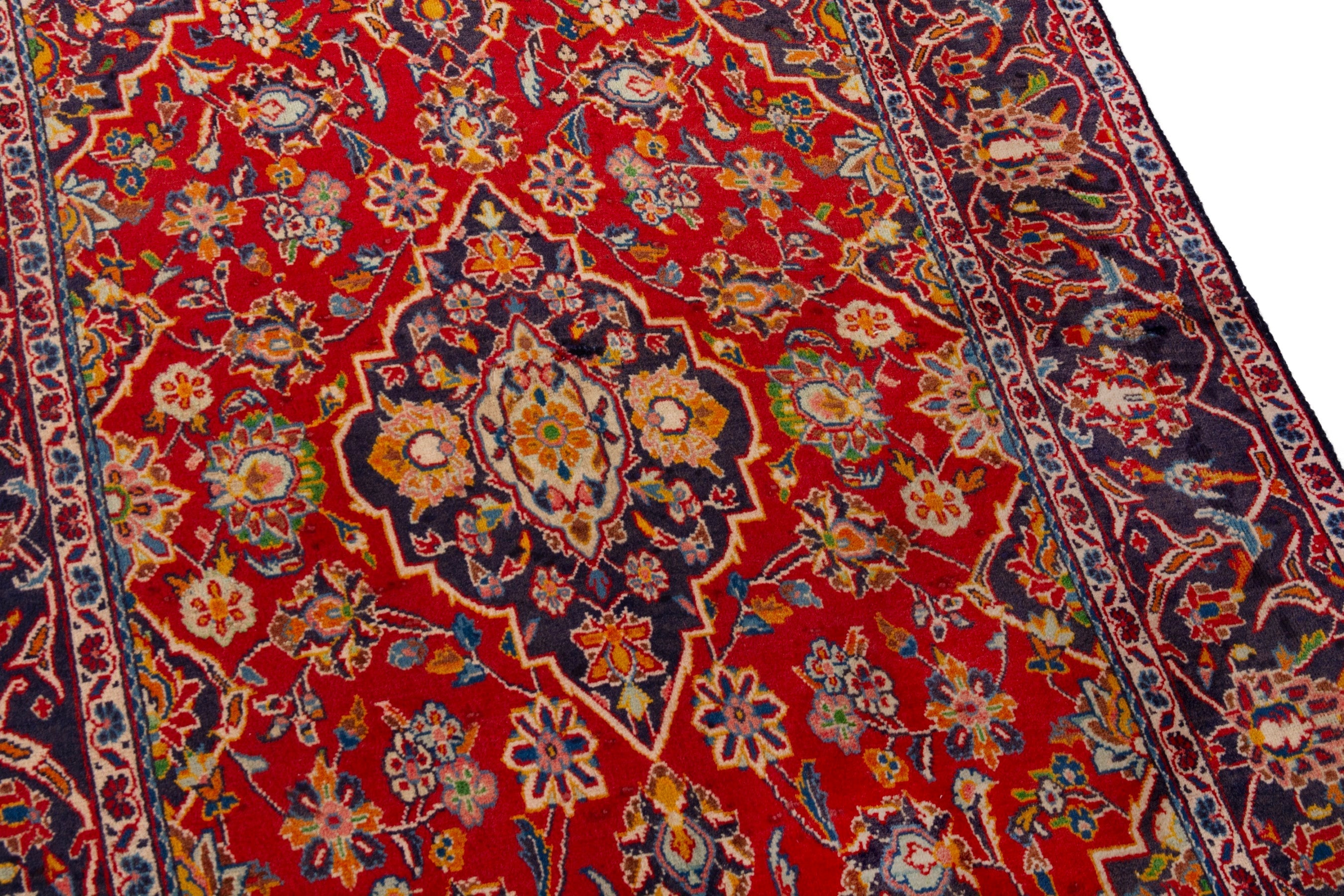 Persian Kashan area rug in deep red and navy, view 9 of 18