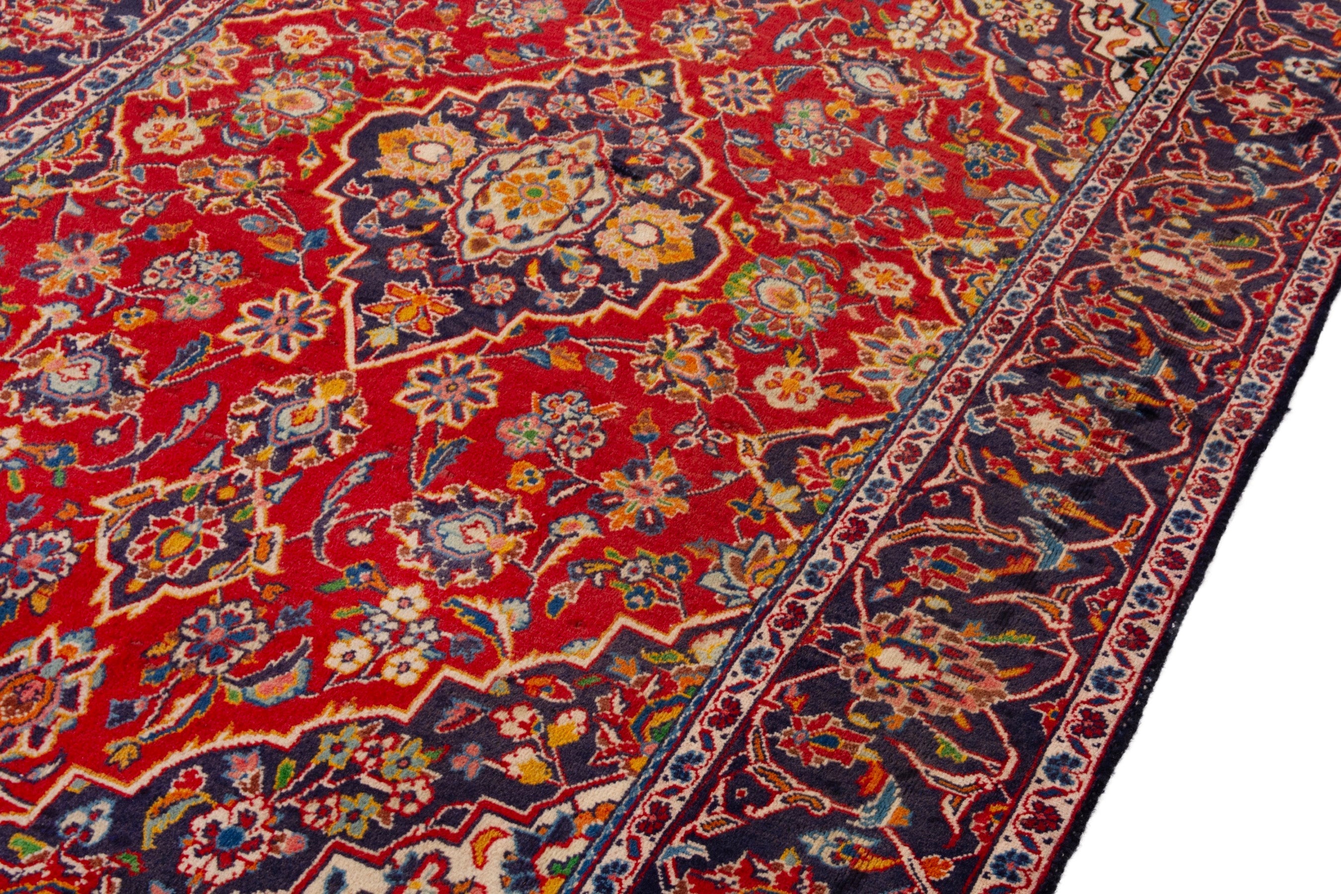 Persian Kashan area rug in deep red and navy, view 7 of 18