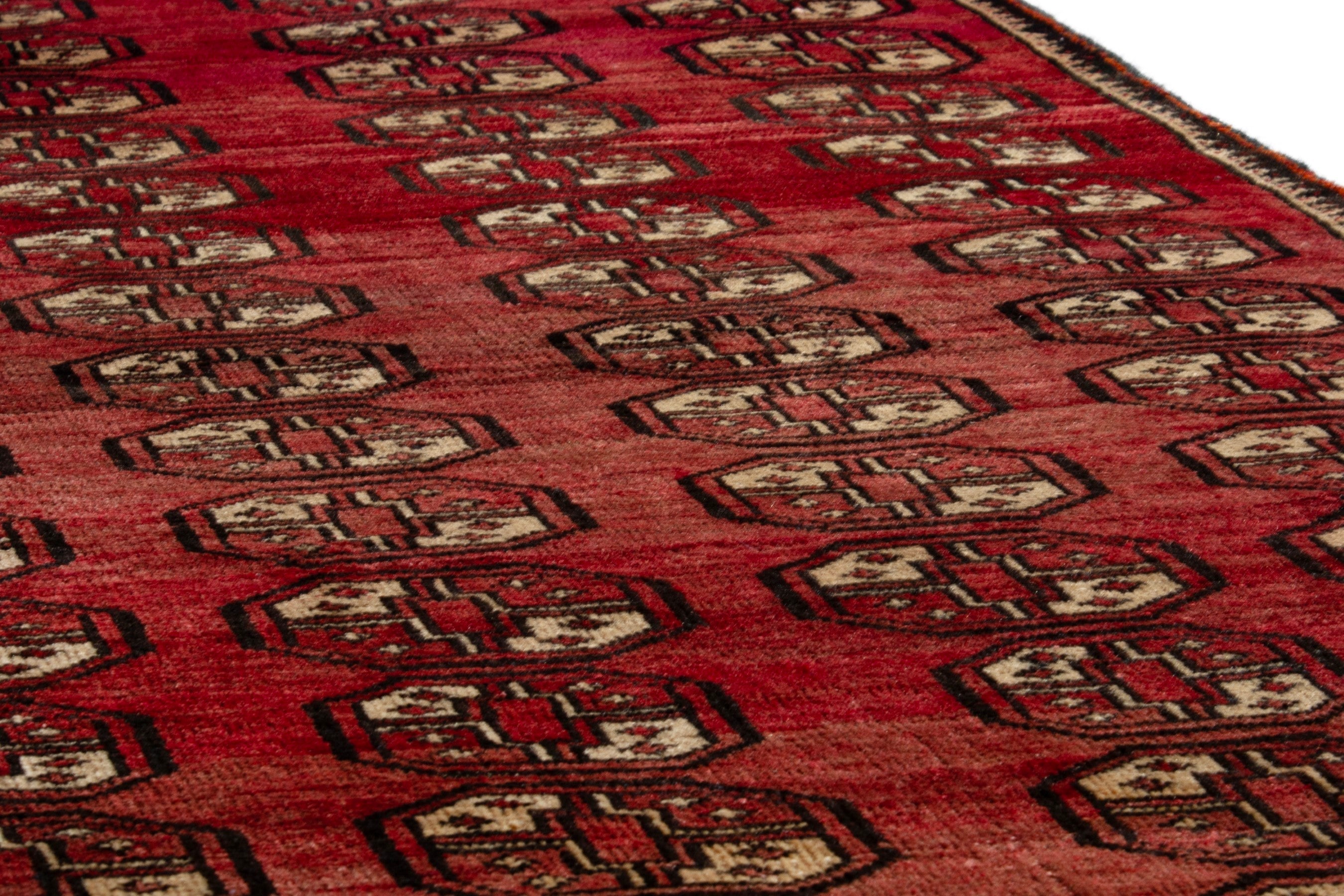 Persian Baluch runner rug in deep red and antique gold, view 8 of 16