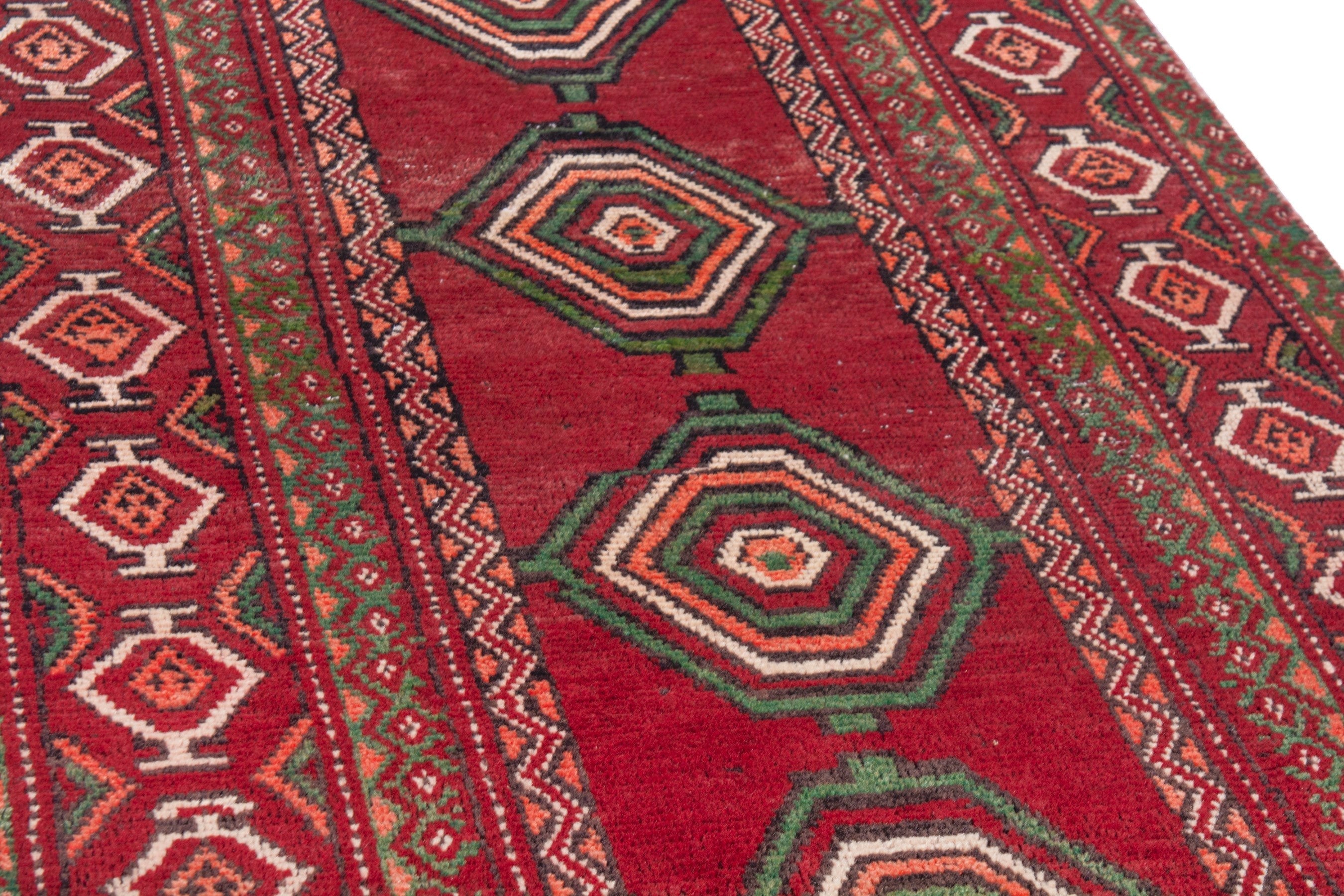 Persian Torkaman runner rug in deep red and faded red, view 8 of 22