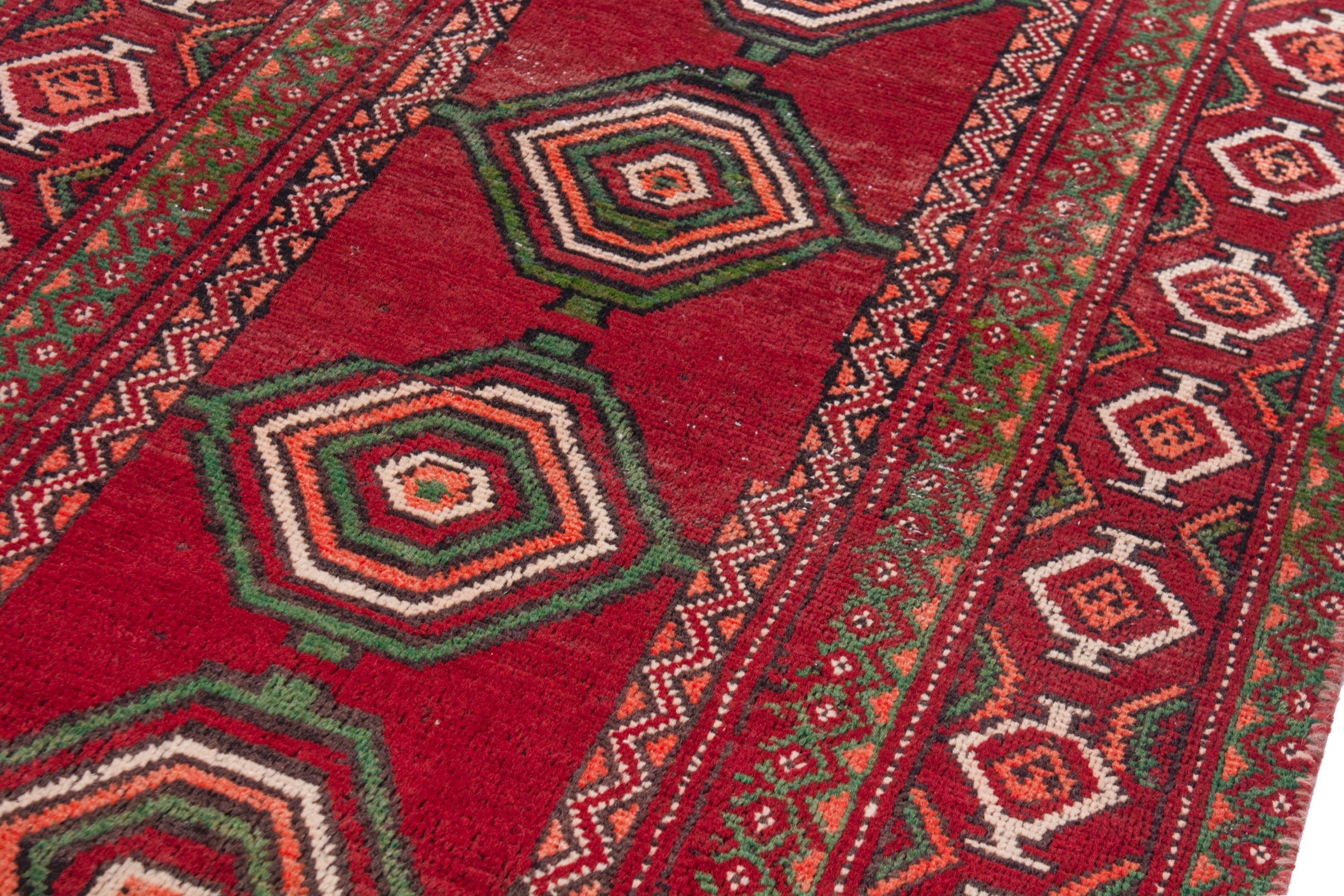 Persian Torkaman runner rug in deep red and faded red, view 9 of 22